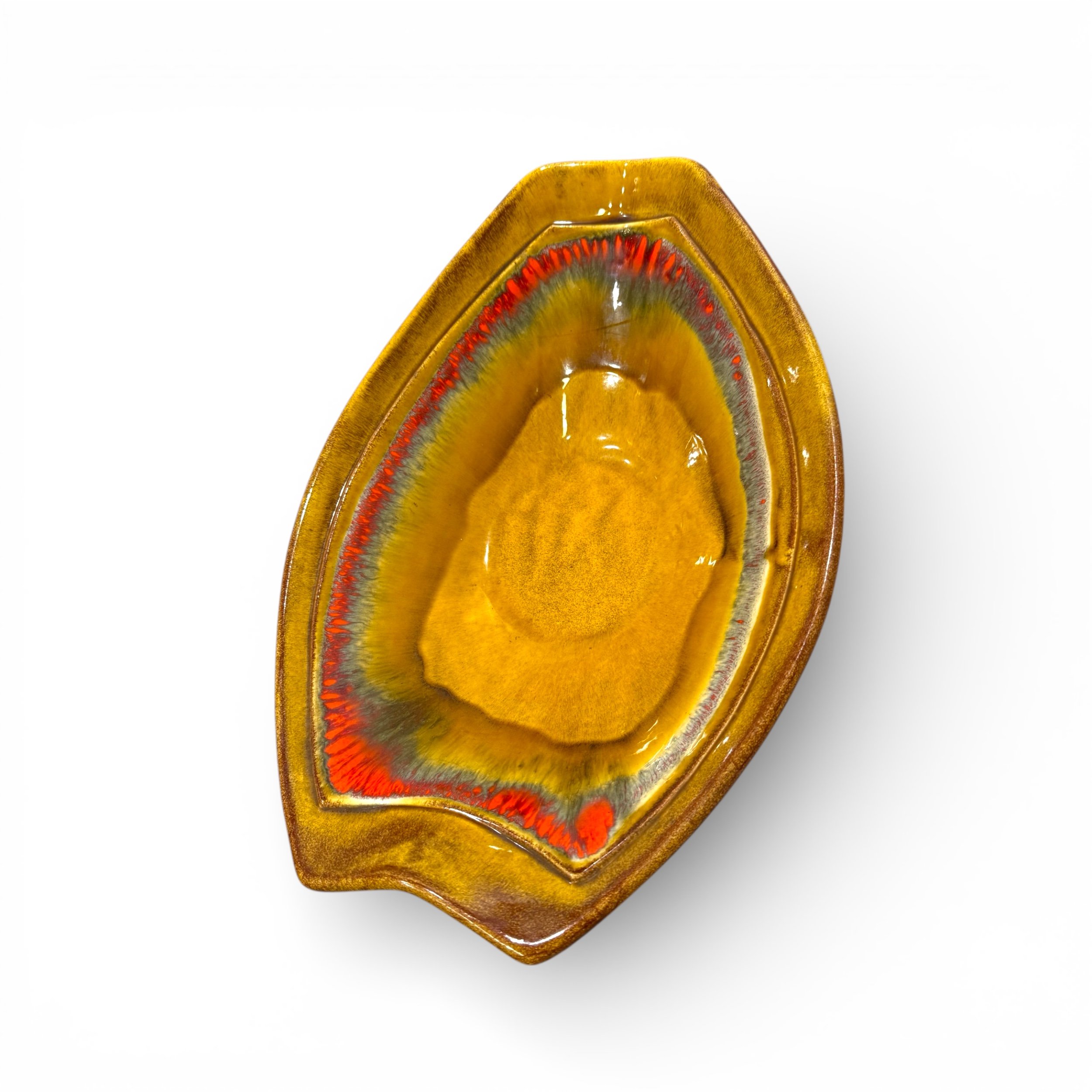 Top view of a colorful glazed ceramic atomic shaped dish perfect for mid century modern interiors