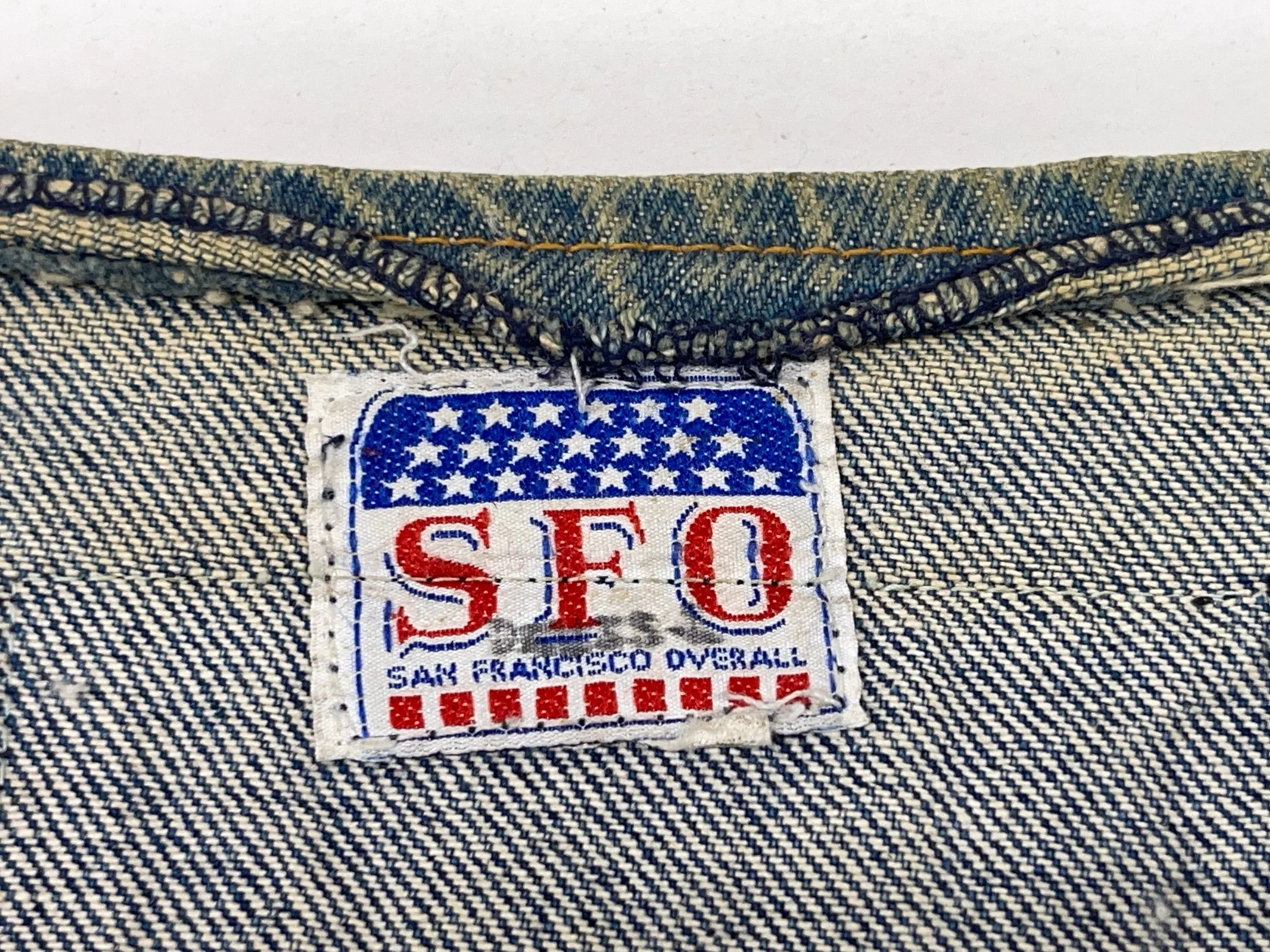 Vintage mens 3XL or 4XL denim vest by SFO San Francisco Overall with vintage military patches.