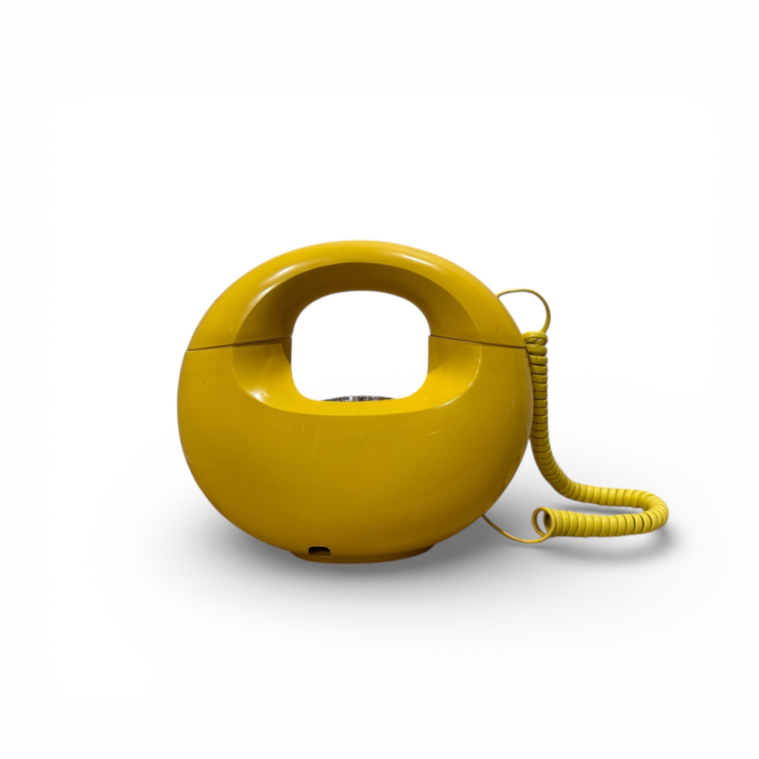 Full back view of Western Electric Sculptura phone in yellow on white background