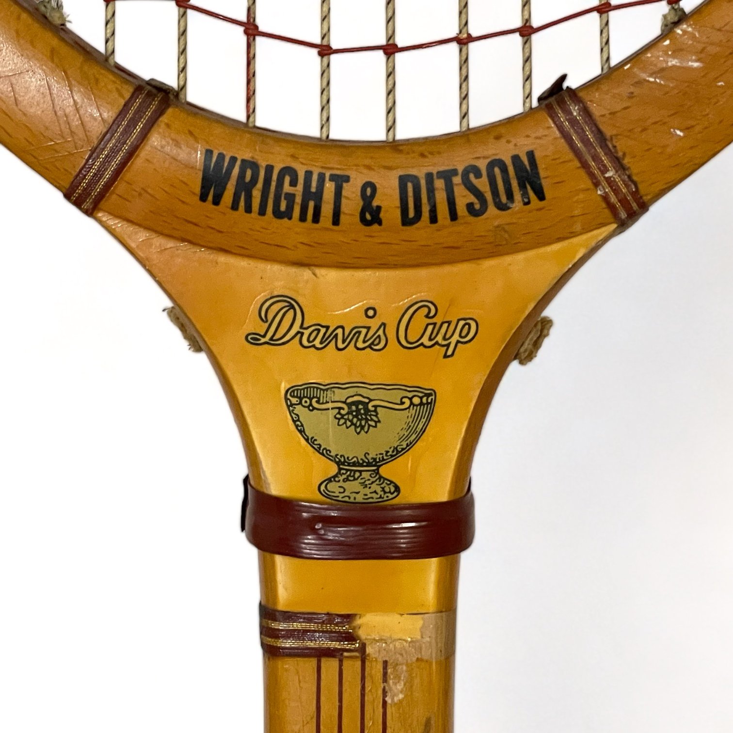 Vintage pair of wooden tennis rackets by Wright & Ditson and Playrite with wood press and canvas covers.