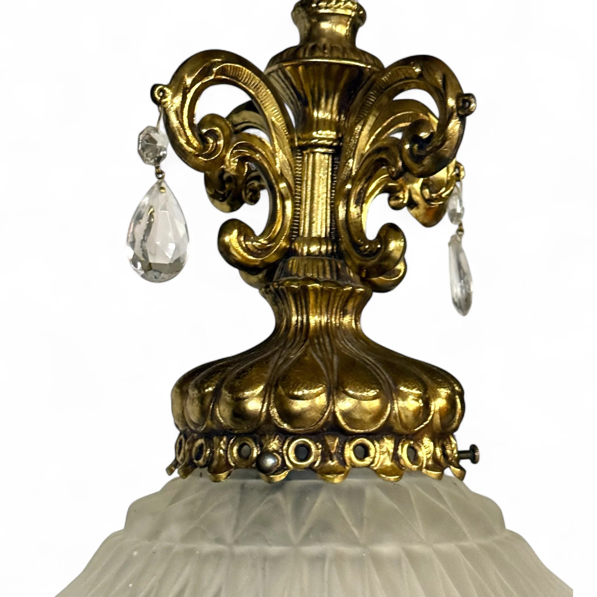 Vintage mid century plug in swag pendant light with ornate gold detailing and frosted beveled glass shade, hanging from a gold chain, perfect for glam interiors.