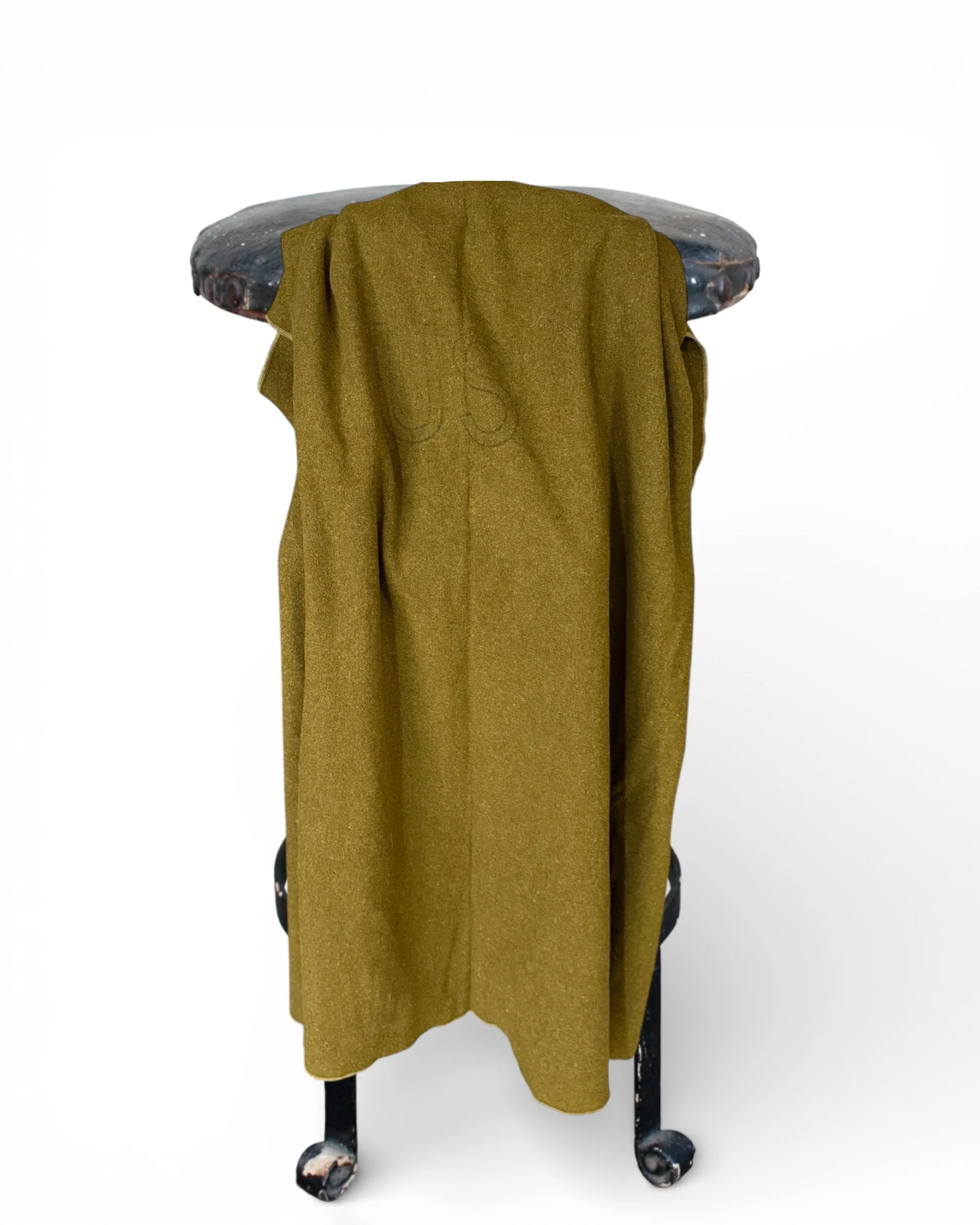 US military wool blanket rustic cabin decor camping survival blanket draped over an industrial stool