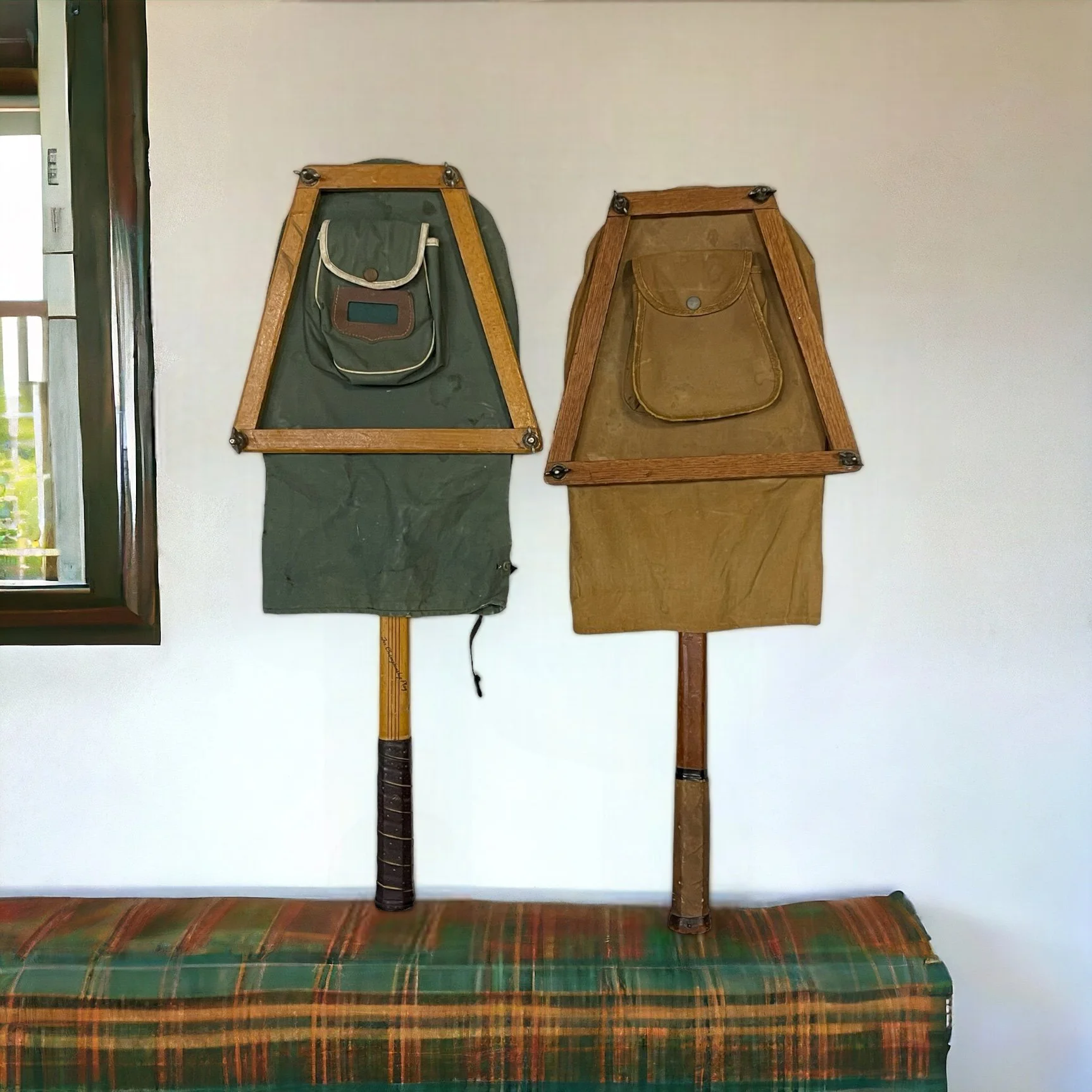 Vintage pair of wooden tennis rackets by Wright & Ditson and Playrite with wood press and canvas covers.