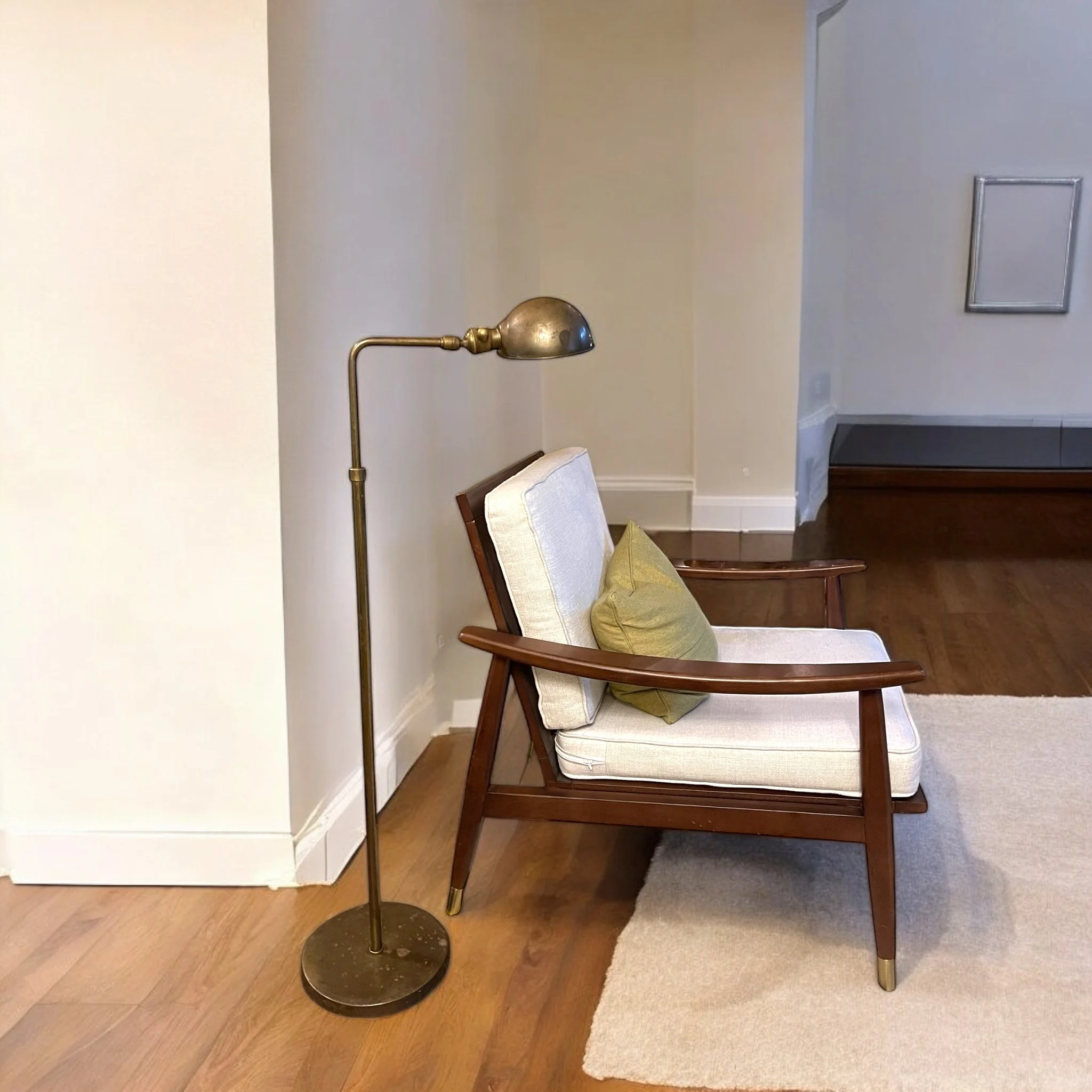 Vintage Chapman style brass pharmacy floor lamp, height fully adjustable, articulating round shade, round weighted base, circa 1960s.