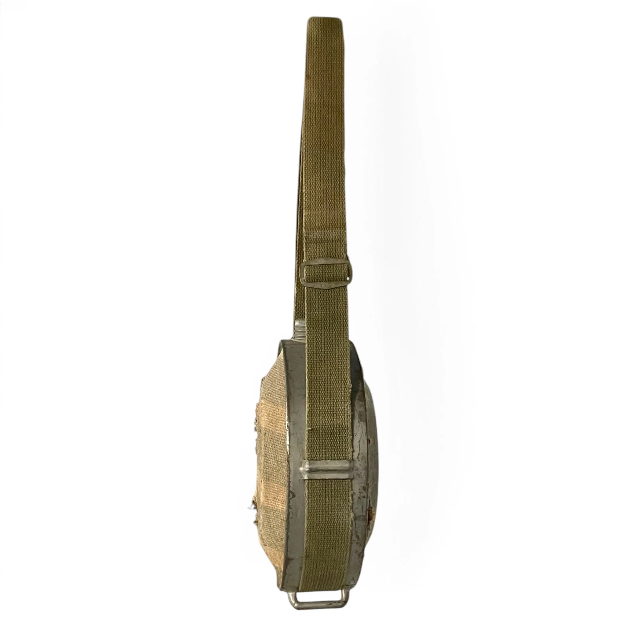 Vintage blanket and galvanized metal canteen with adjustable canvas strap, for rustic decor use.