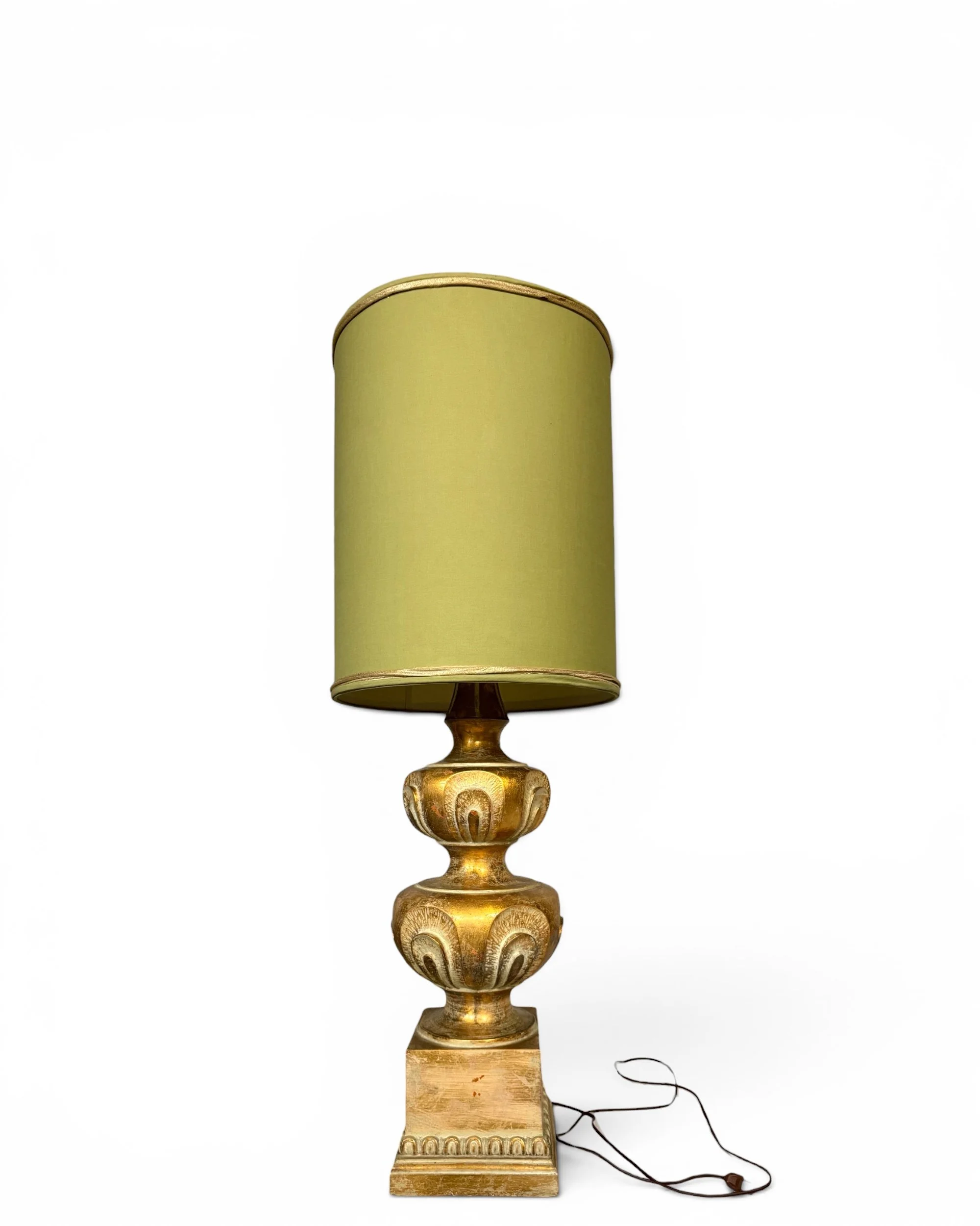 Large vintage Hollywood Regency gold chalkware table lamp with ornate urn base and avocado green drum lampshade.