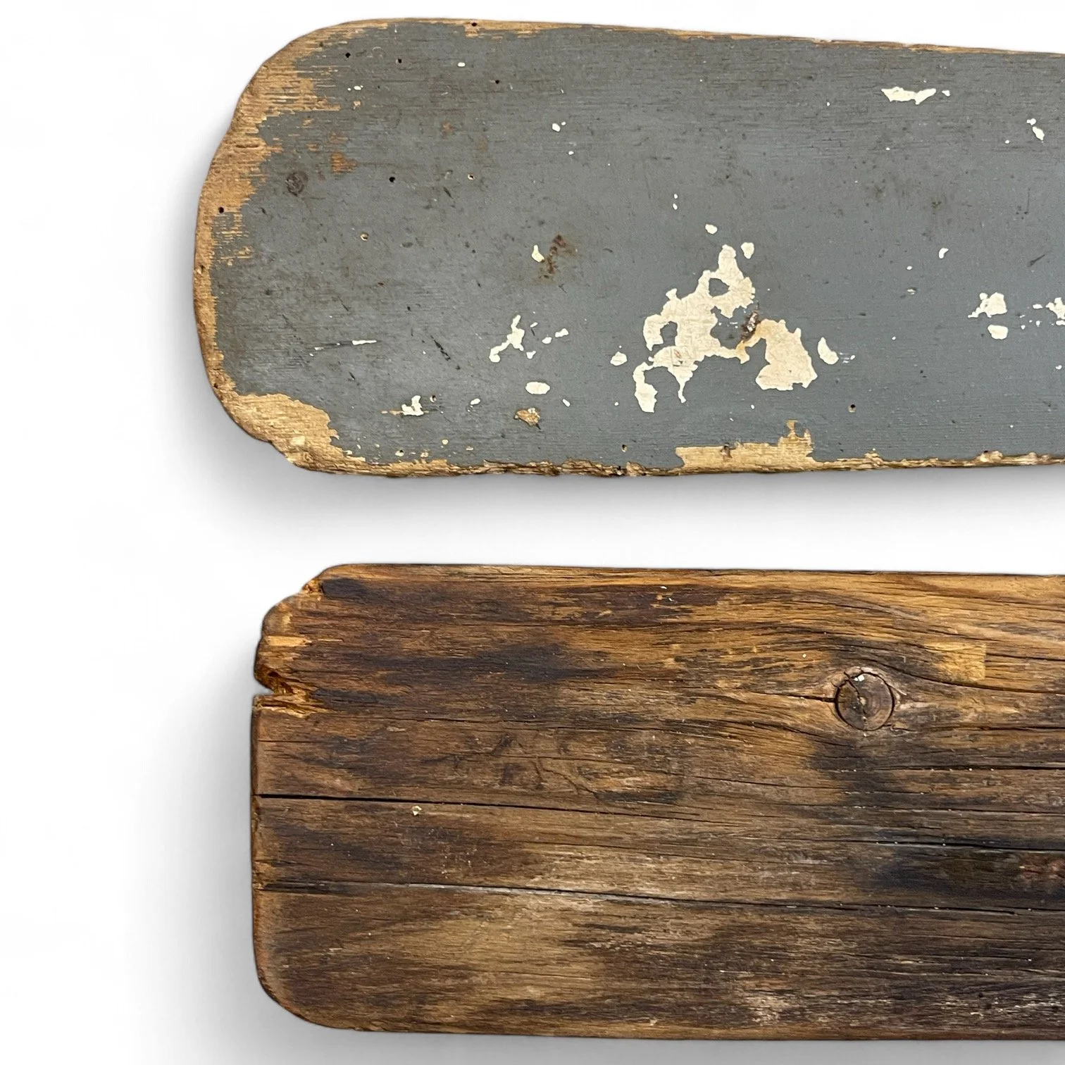 Pair of vintage wooden mismatched boat oars.