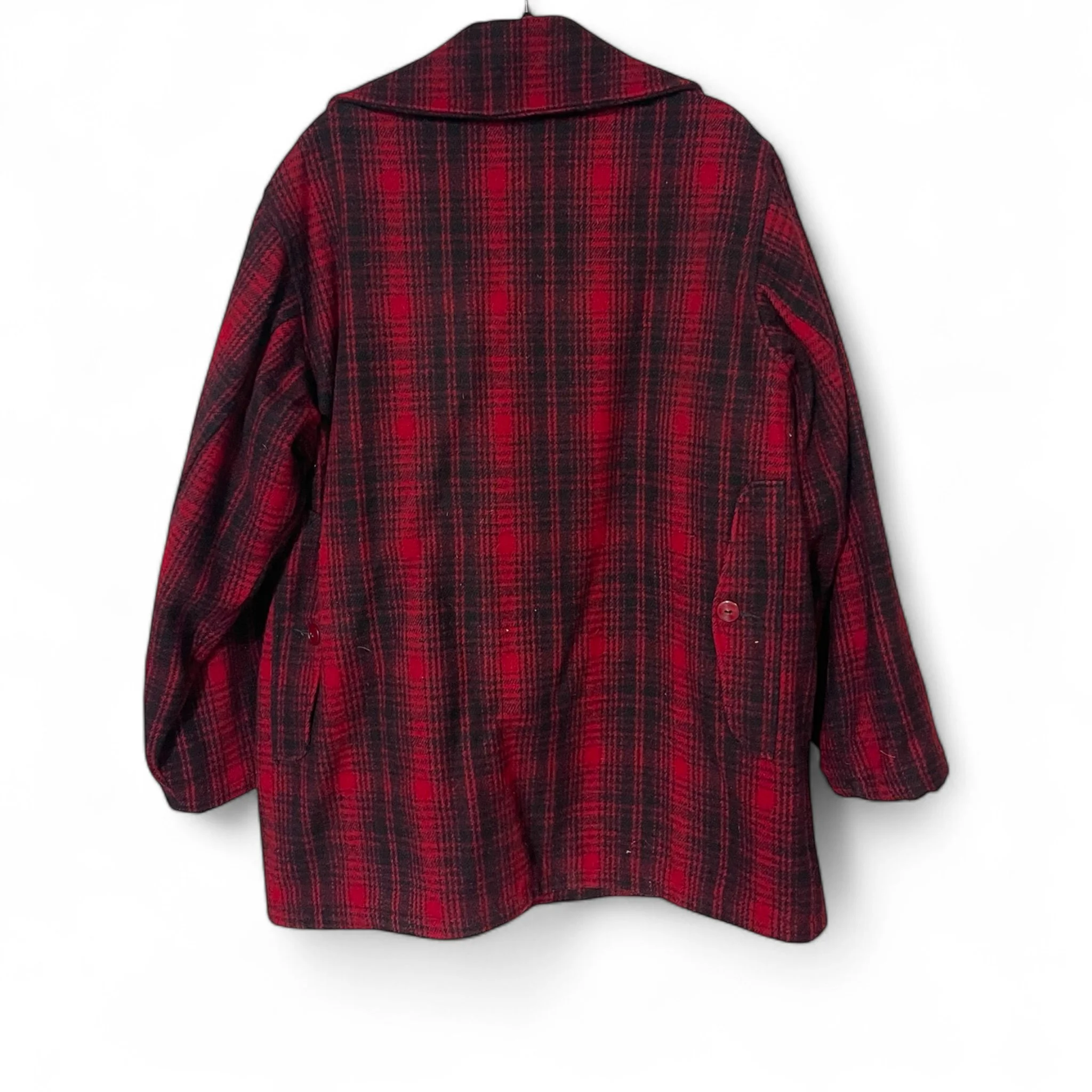 Vintage 70s Woolrich black red plaid jacket. Size 46 long, fully lined, hidden button front closure with 6 front pockets with snap closure,  full game pocket. This Mackinaw style coat Made in USA.