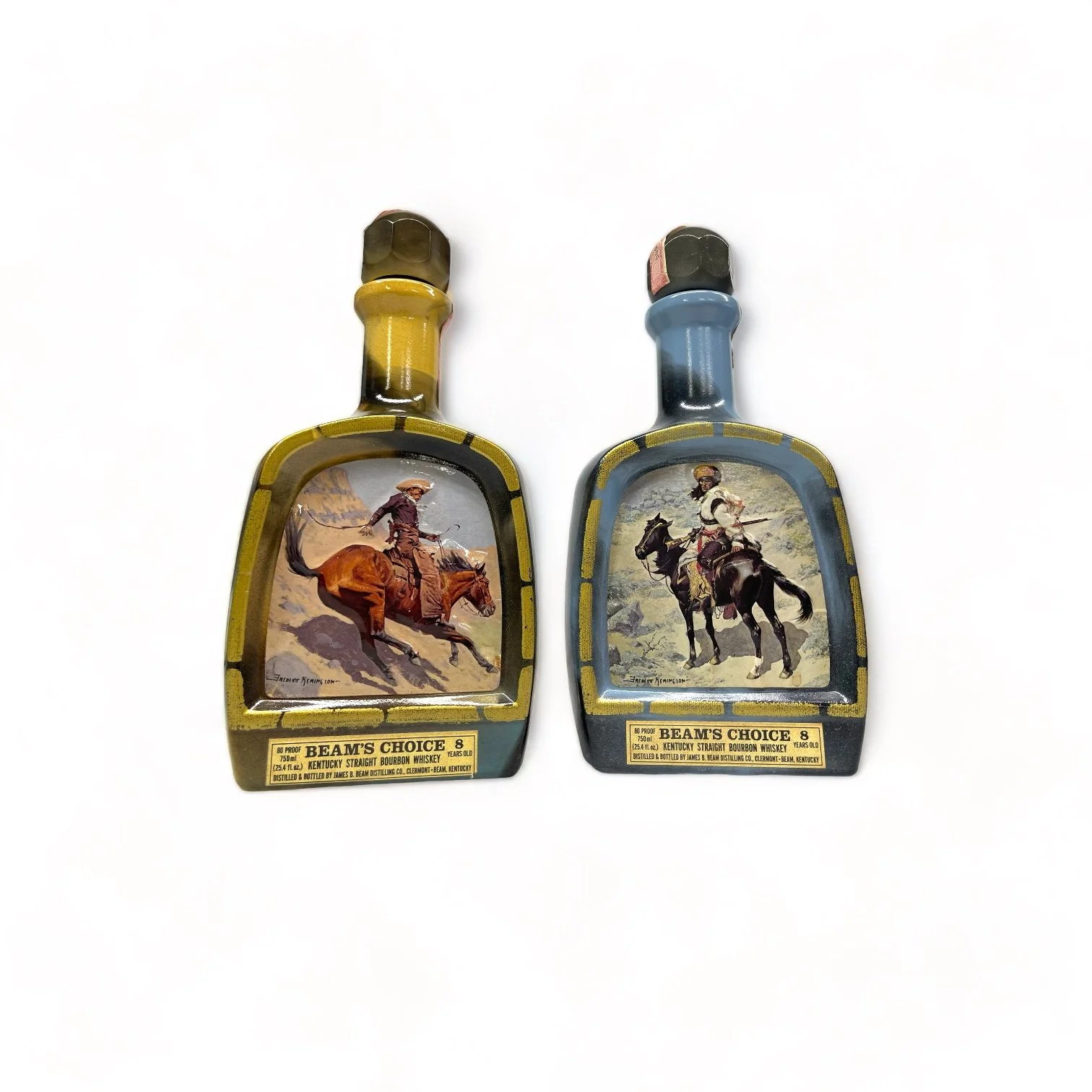 Vintage pair of glass 1970s Jim Beam Choice liquor bottles, featuring the cowboy and the Indian trapper. Perfect home bar decor.
