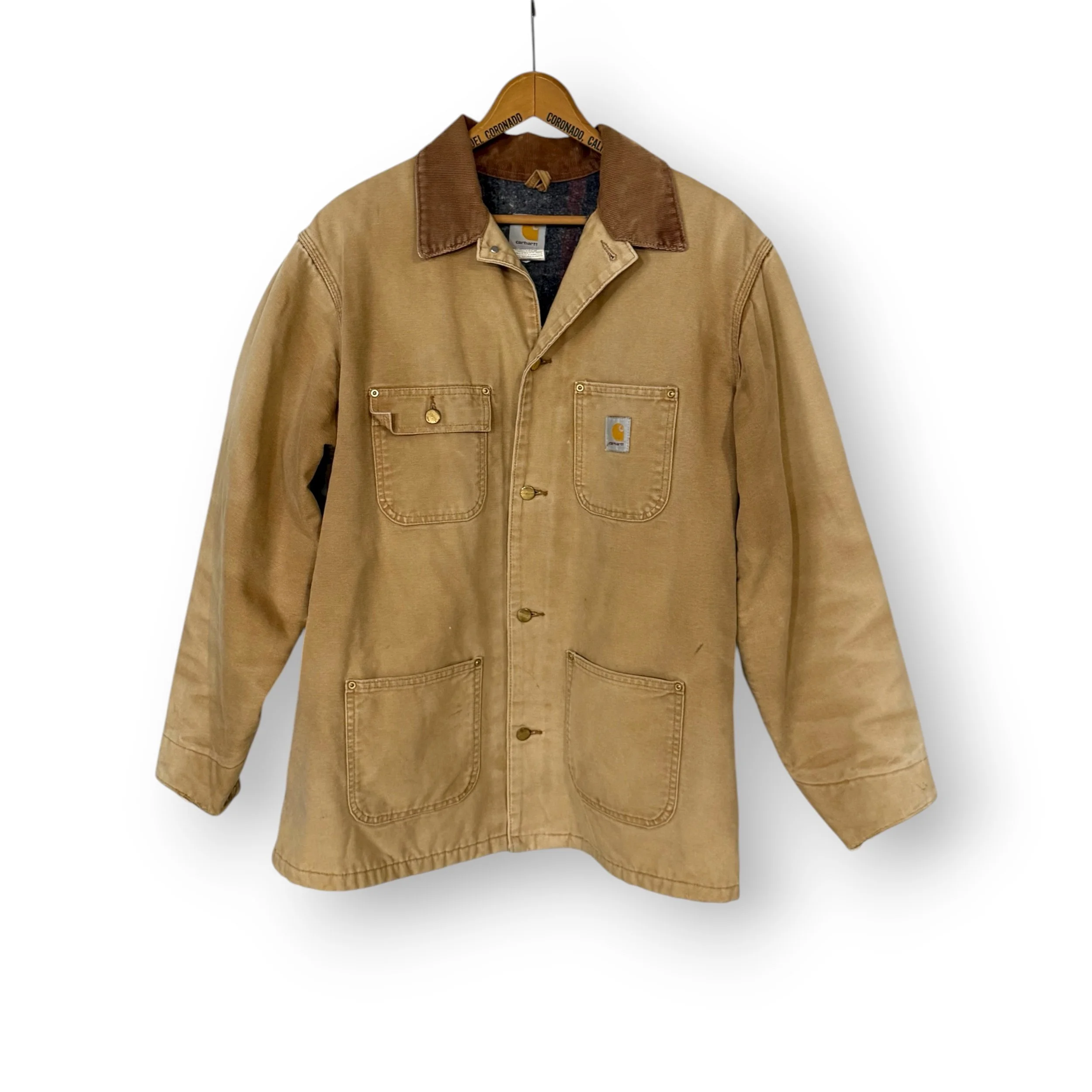 Vintage Carhartt brown button-front blanket lined chore jacket size 44 tall on hanger
