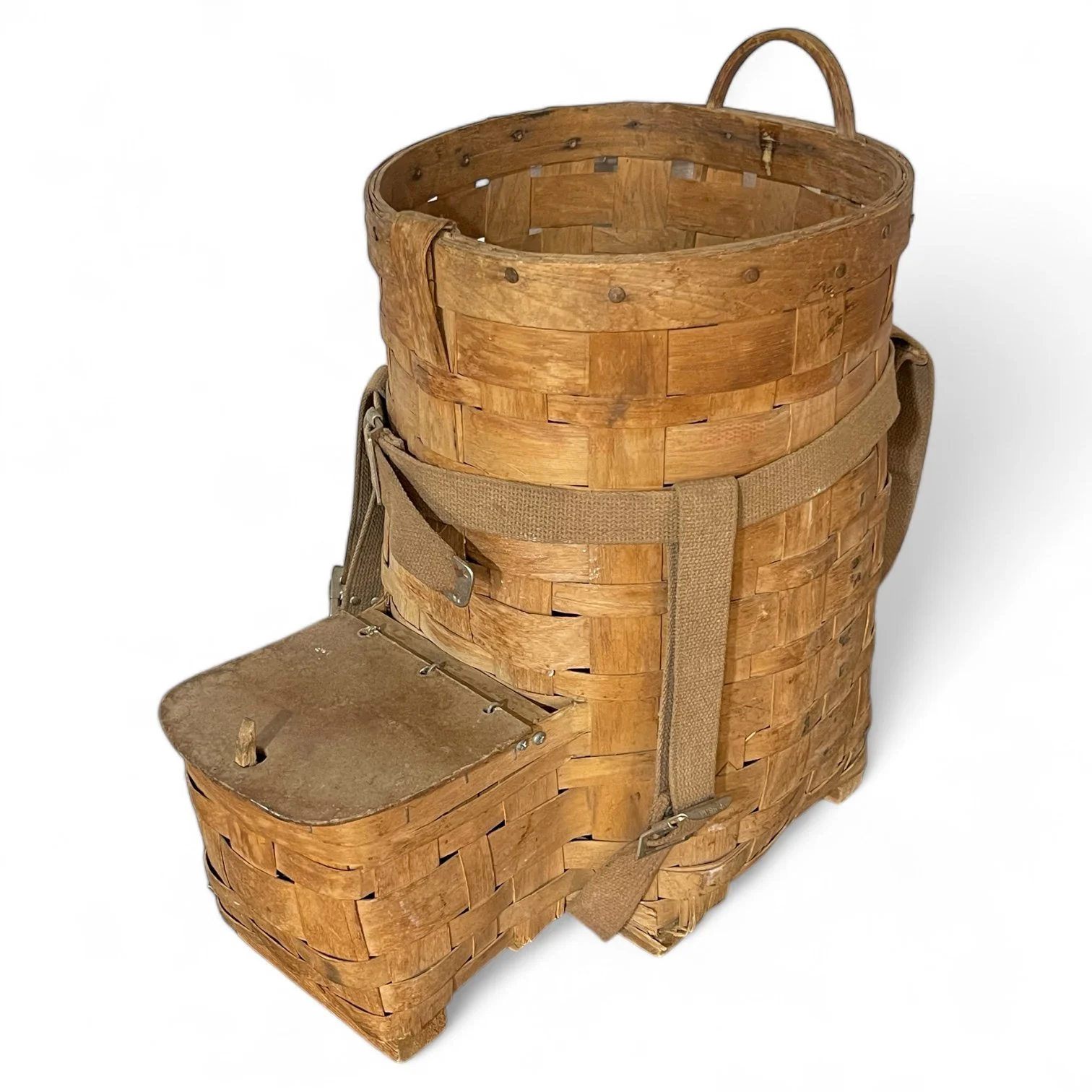 Side view of a large vintage Adirondack Pack Basket - 2 Compartments, 1 with lid, canvas adjustable shoulder straps.