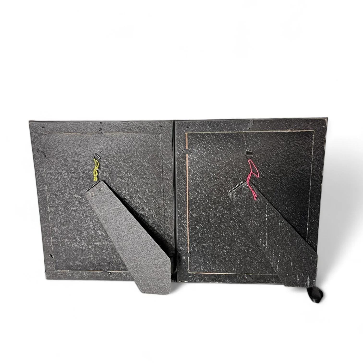 Backside view of a pair of 8x10 gold frames.