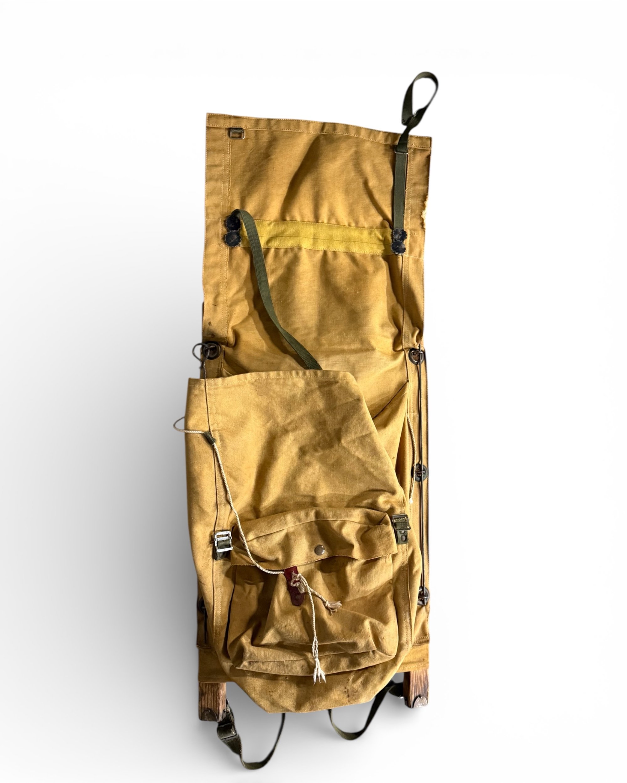 vintage wooden packboard frame with canvas bag shown open