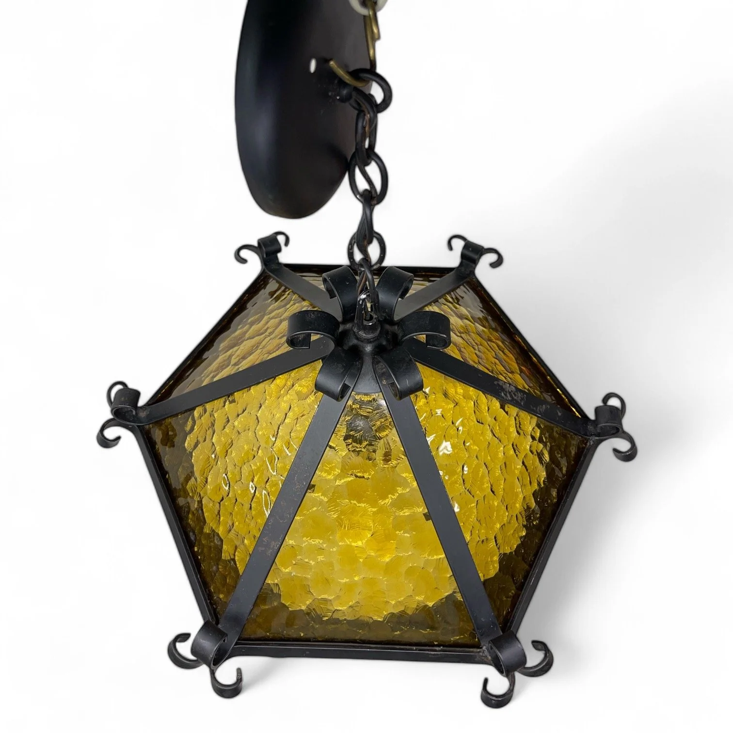 Vintage Spanish Revival wrought iron and amber glass semi flush mount ceiling light, circa 1970s, by Hi-Lite Mfg. Co.,made in USA