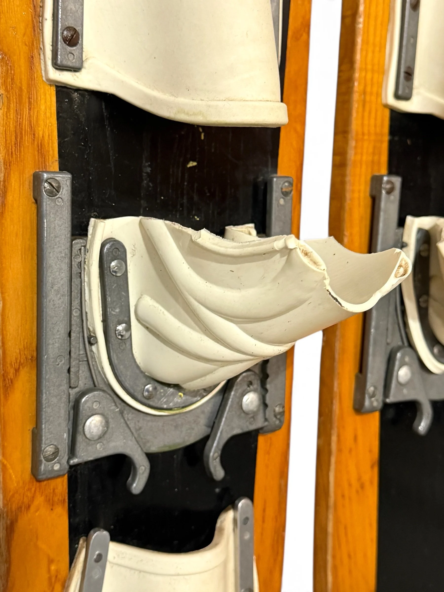 Detail of bindings and wood grain on vintage Ski Craft Junior Combo water skis