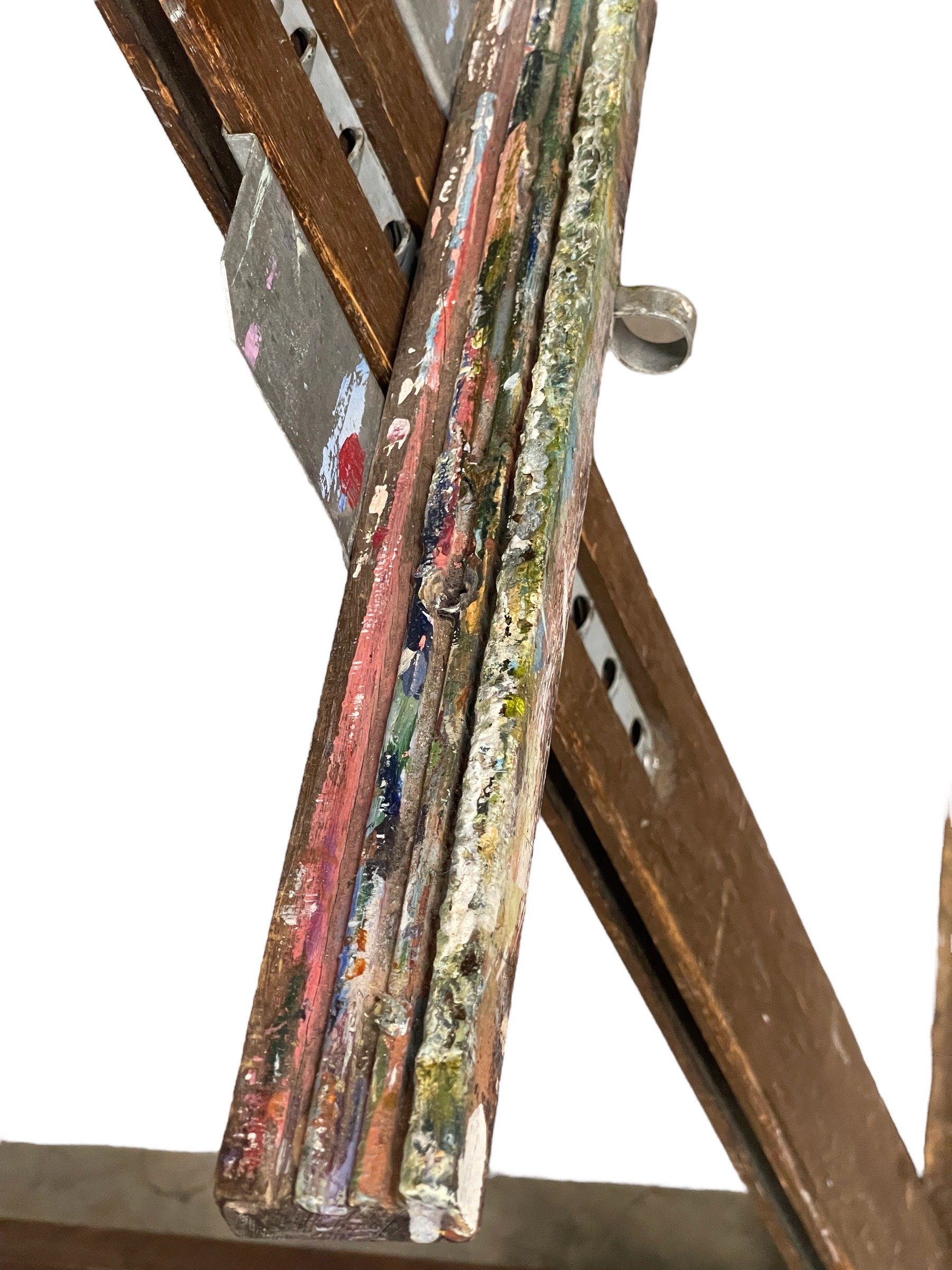 top view of tray on vintage floor easel with paint layers