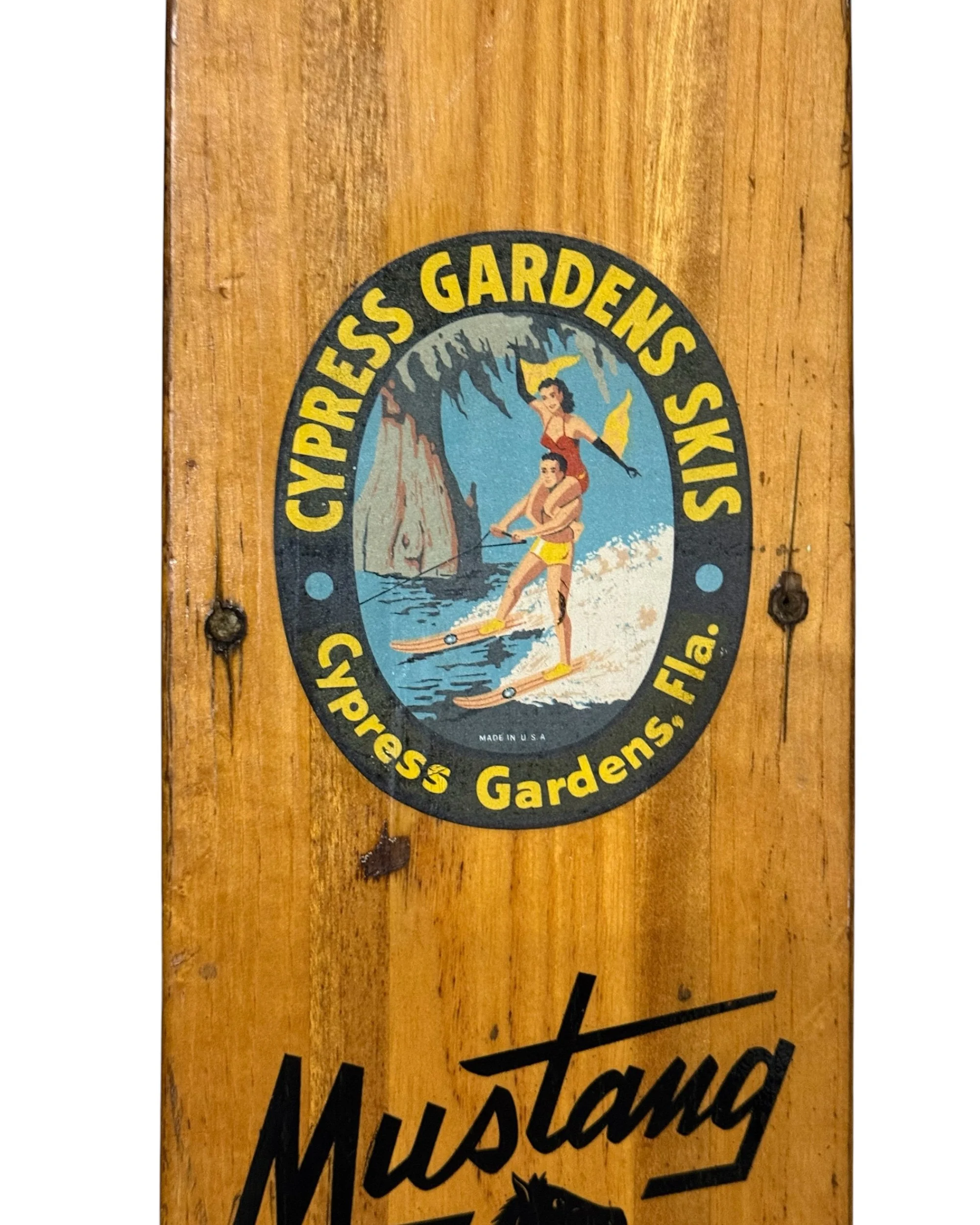 Original Cypress Gardens Skis logo displayed vintage wooden water skis.