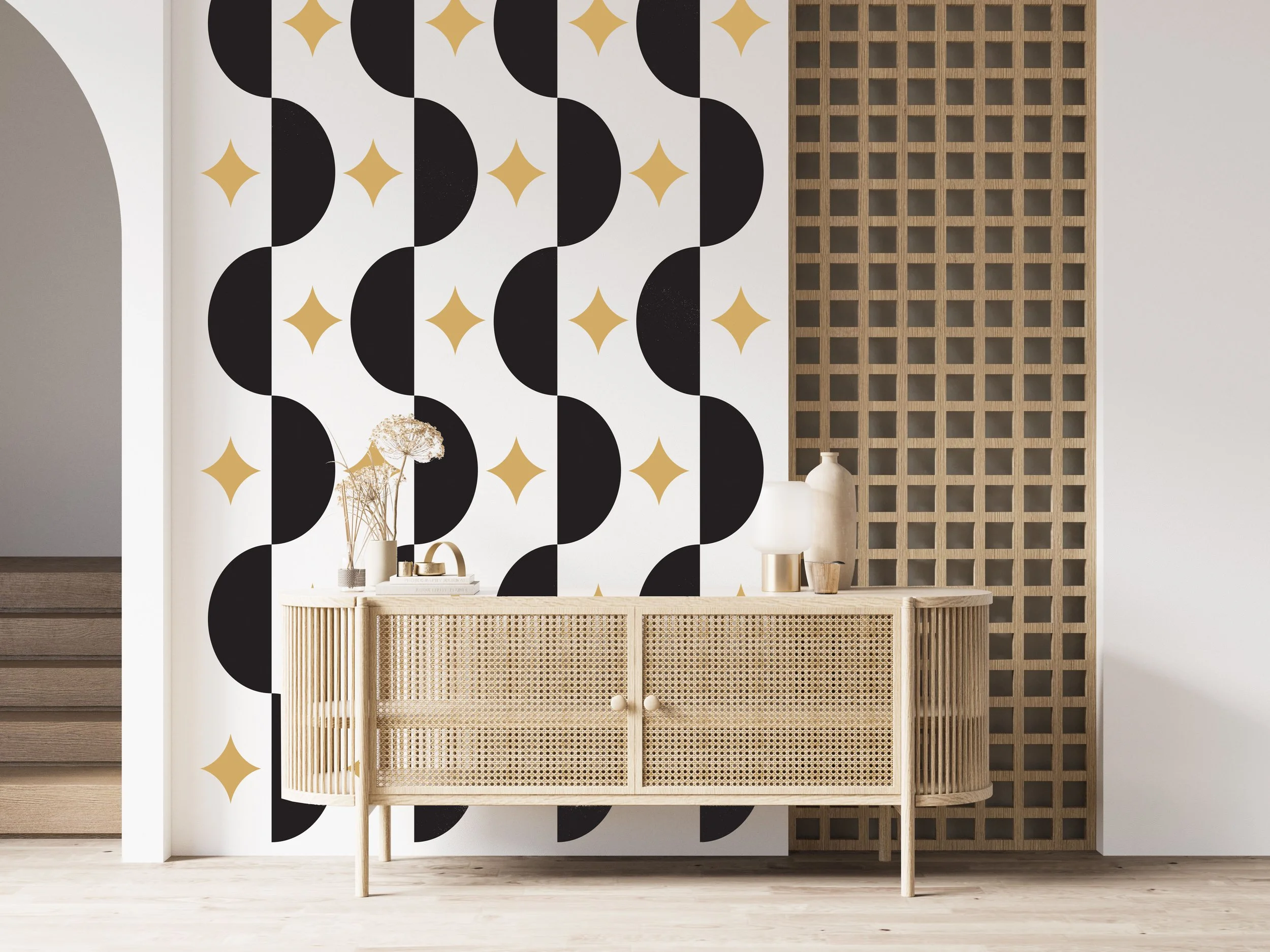 Modern wall decal pattern of half circles and atomic stars buy Wall Star Graphics shown in nut black and metallic gold on a whitewall with a wood credenza in a boho styled interior.