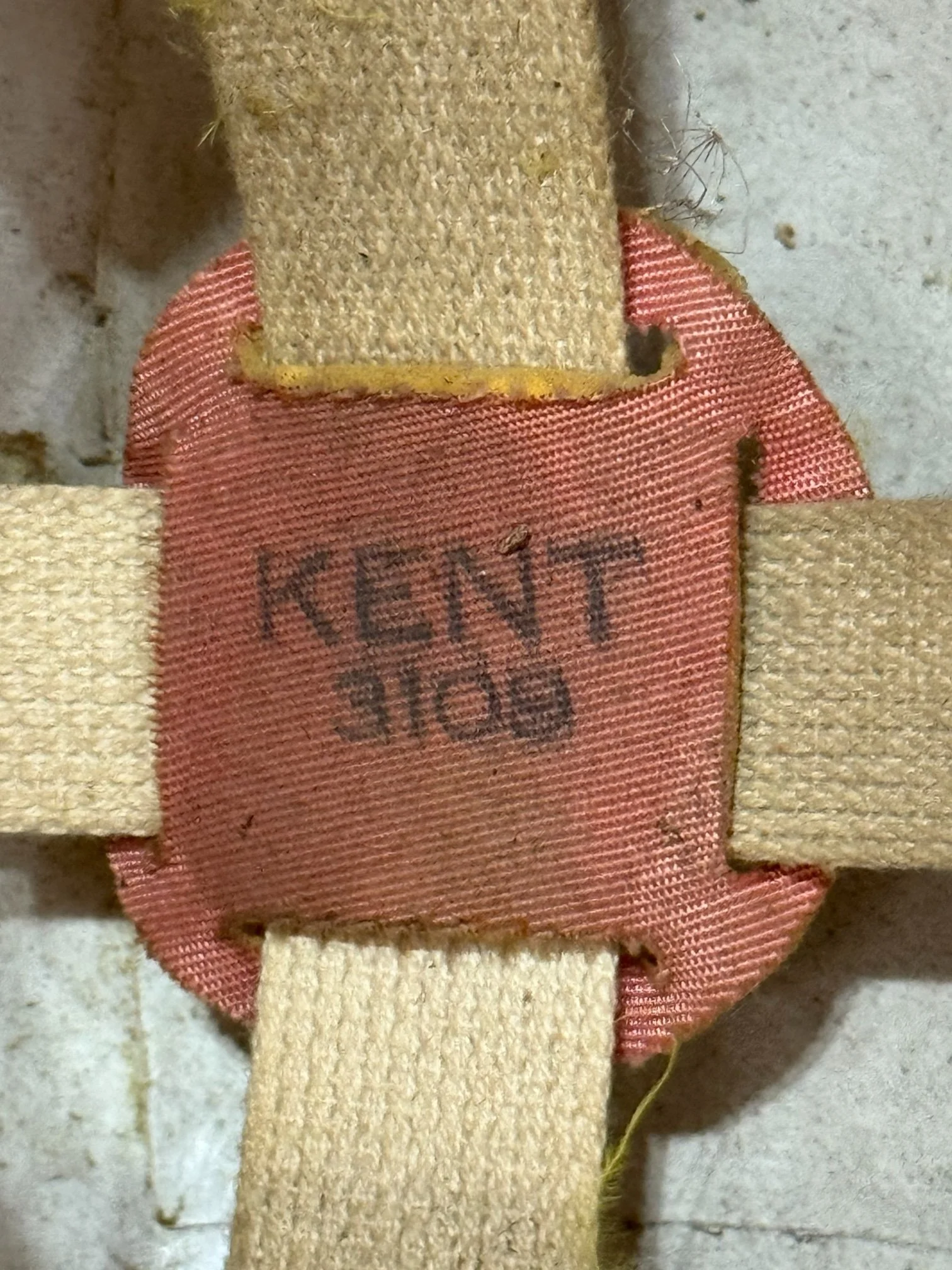 Close-up detail of logo that reads Kent 3109 on interior of 1960s football helmet for kids
