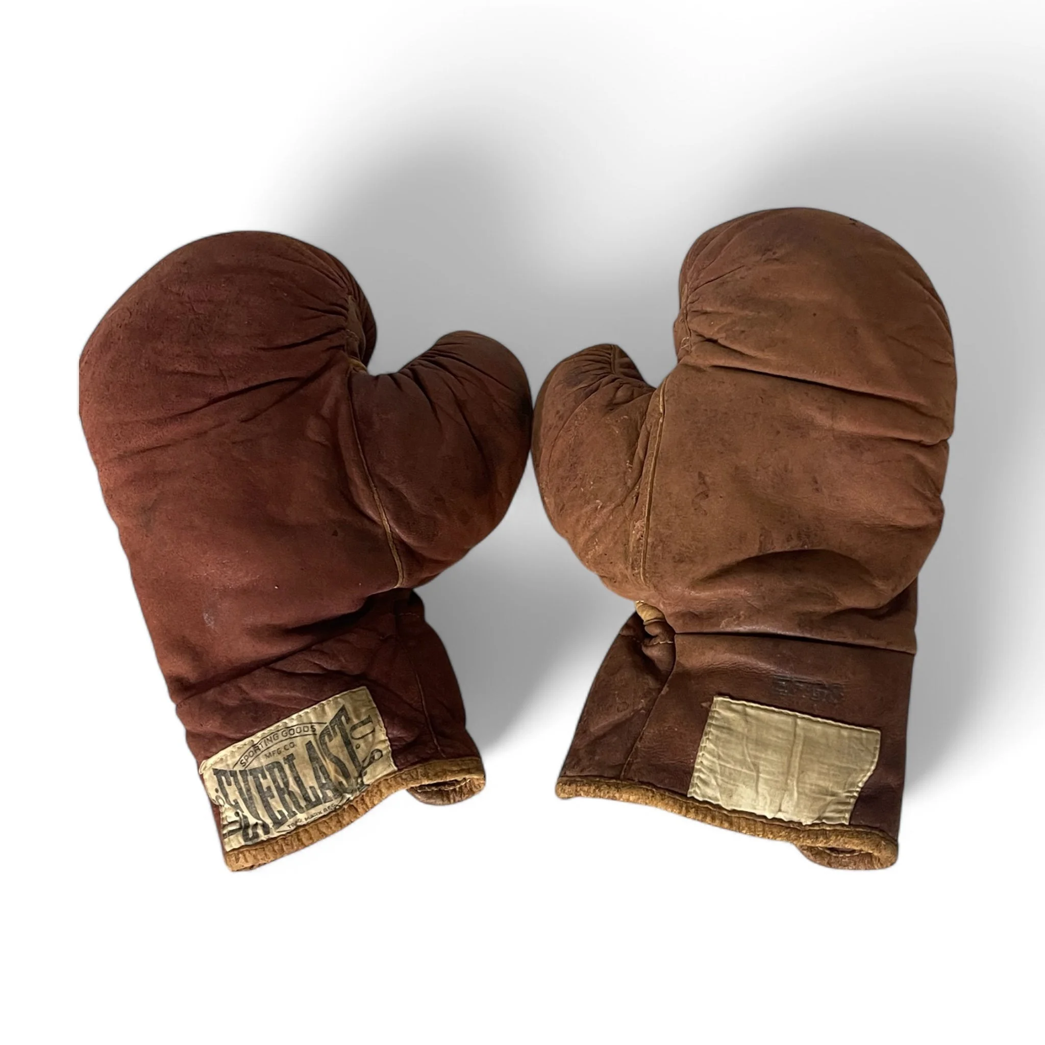 Pair of vintage 1950s Everlast Model EF G8 boxing gloves with rich patina, perfect for game room decor, man cave display, or gift for sports memorabilia collectors.