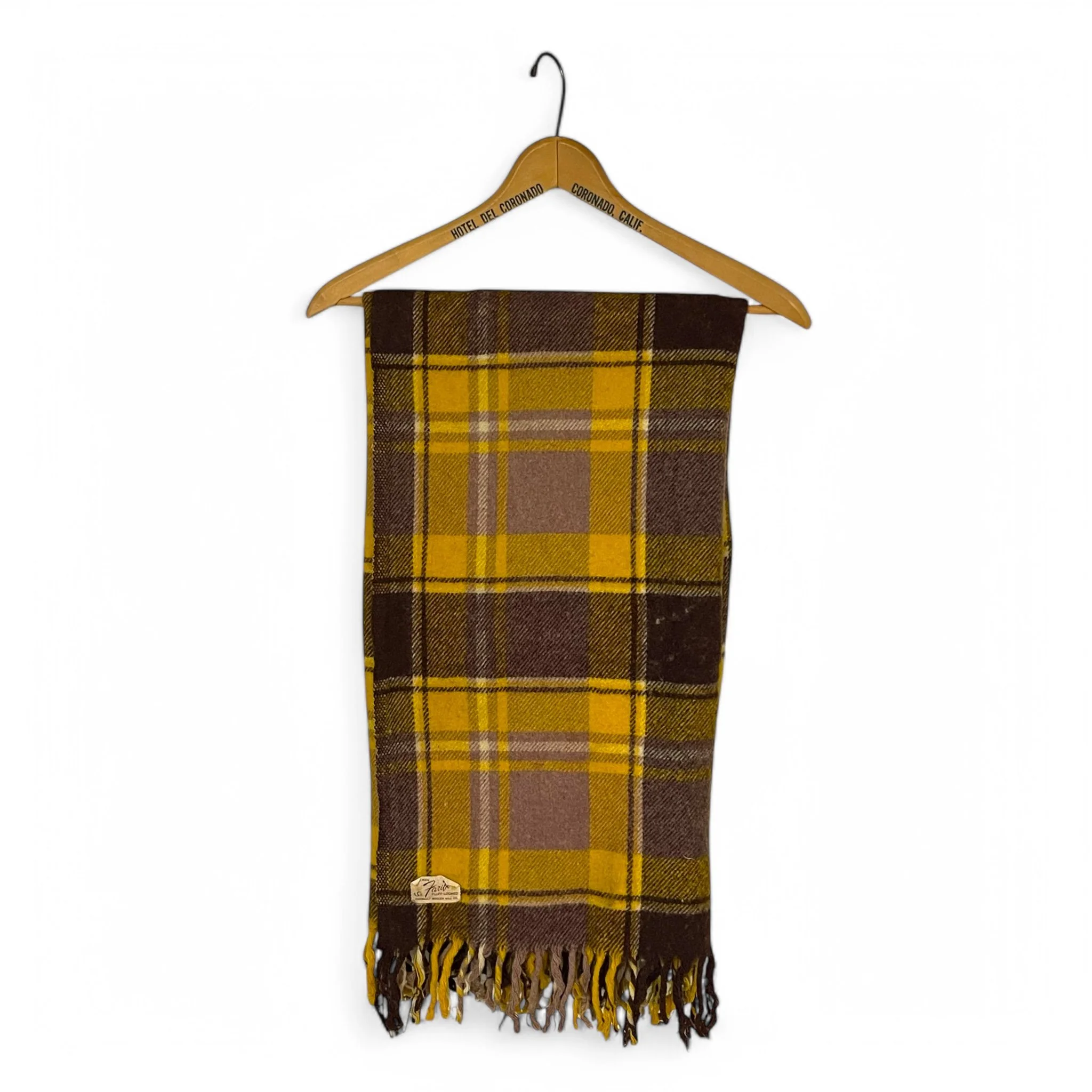 A vintage 100 percent wool brown and yellow plaid throw blanket by Faribo measuring 49x53 inches. Perfect for a cozy winter sofa throw or lap blanket.