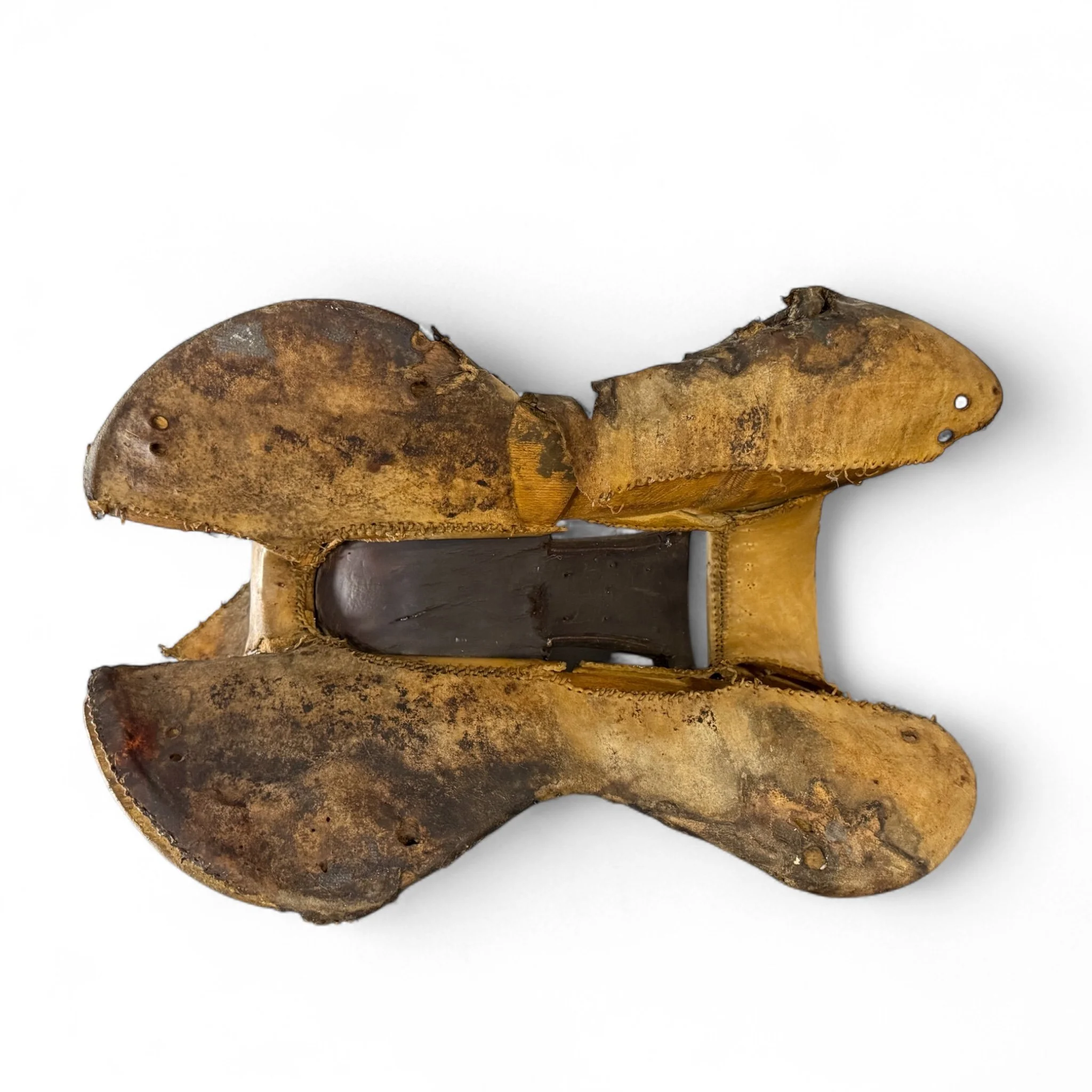 Bottom view of a vintage wooden saddle tree form.