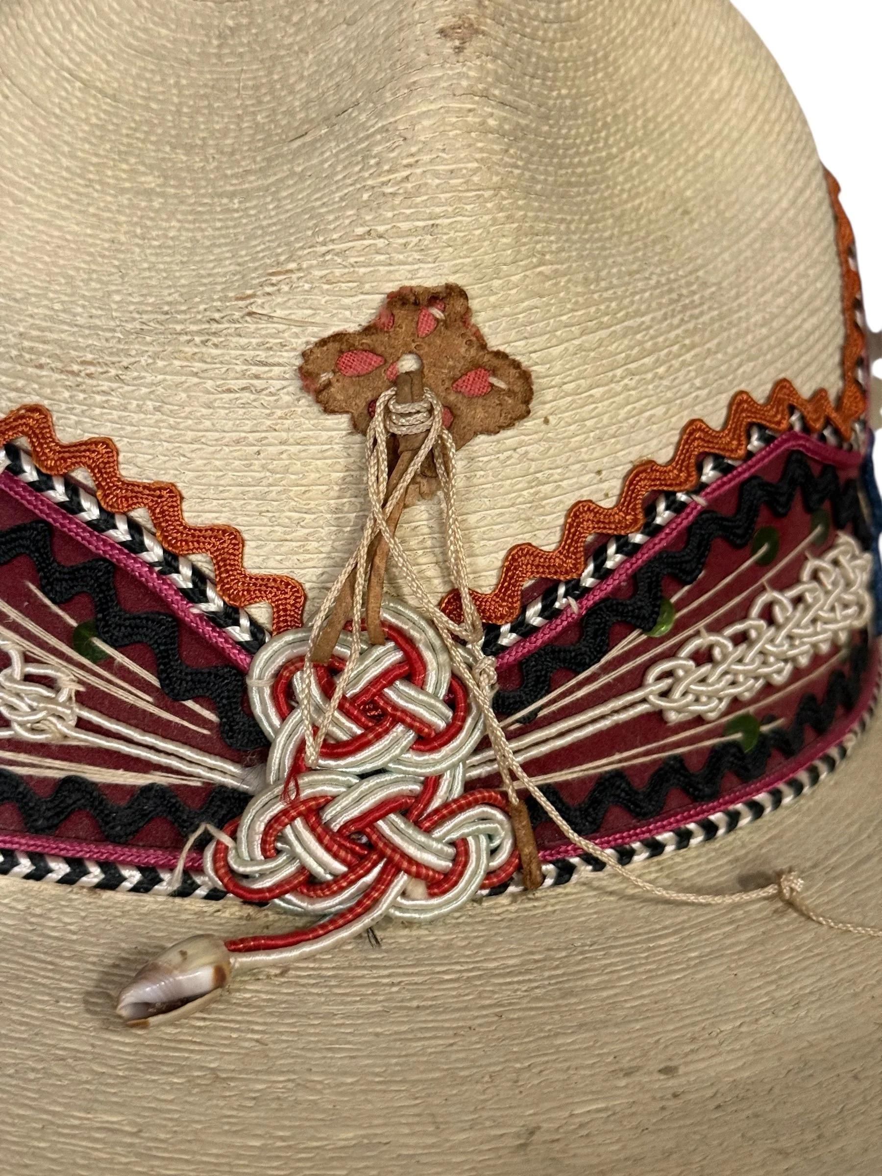 Close-up of embroidery and textured straw weave on a vintage Alberto Chavez sombrero