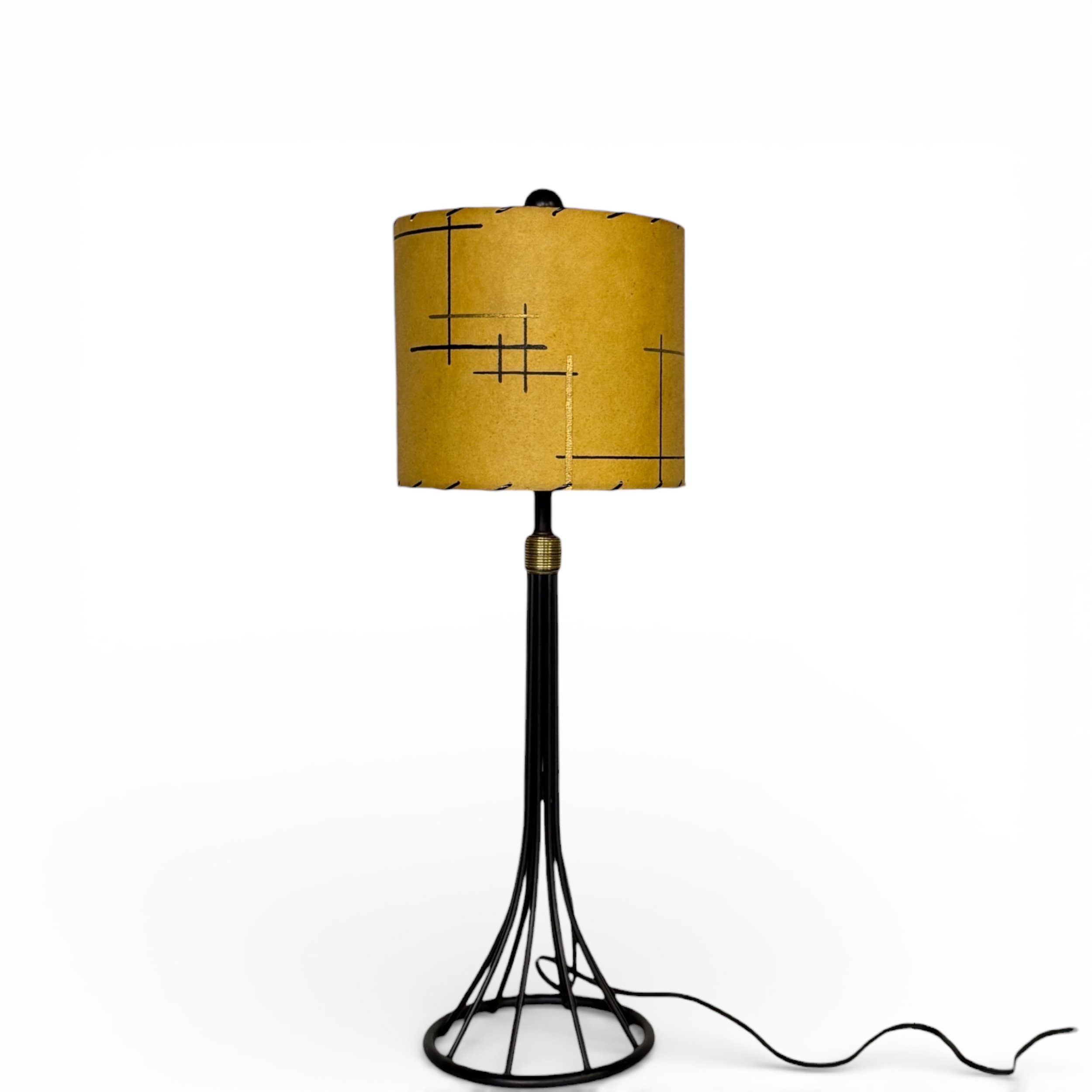 Vintage mid century modern lamp with black metal base and fiberglass shade, shown turned off