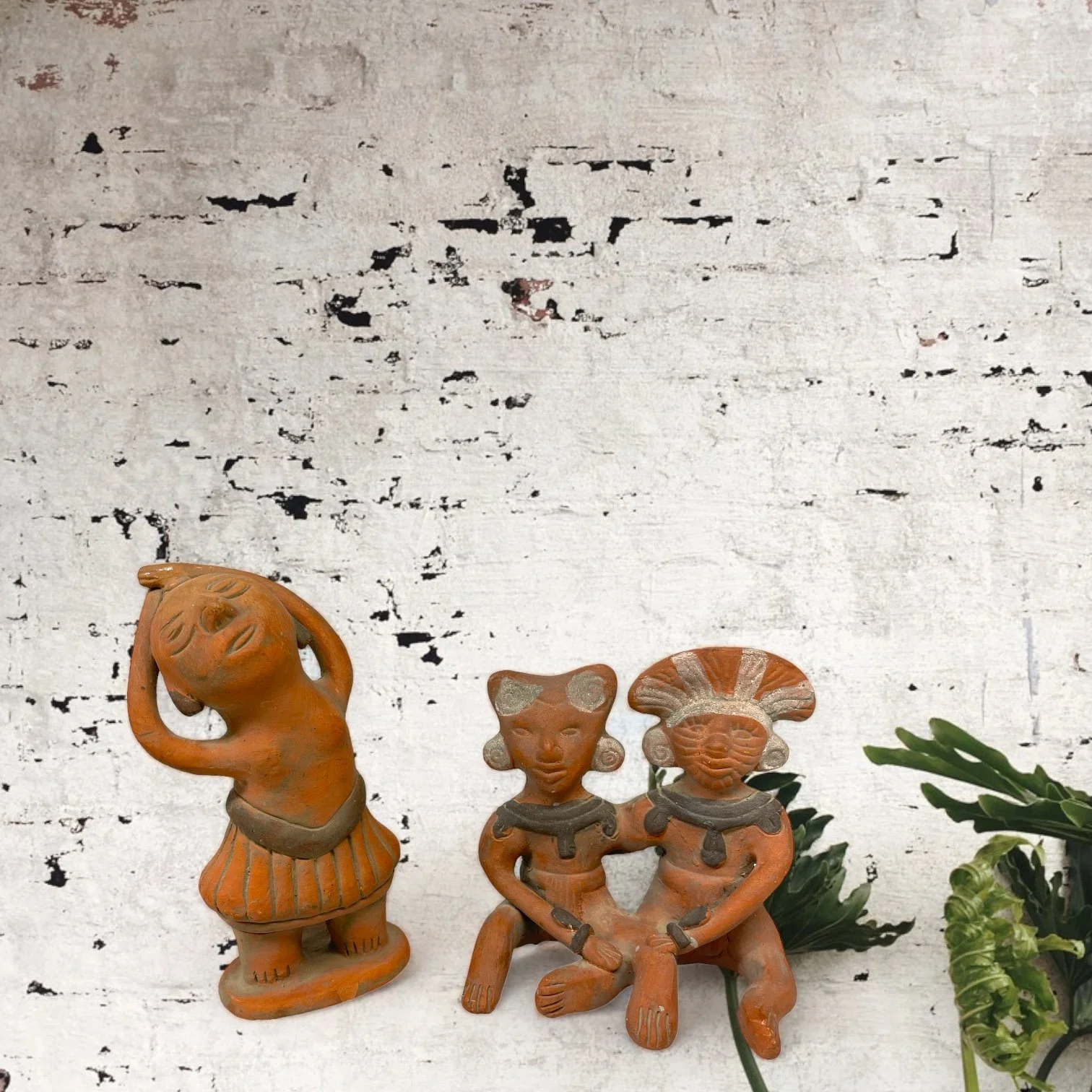 Vintage Mexican terracotta clay figures set with folk art style, including a dance and a couple.