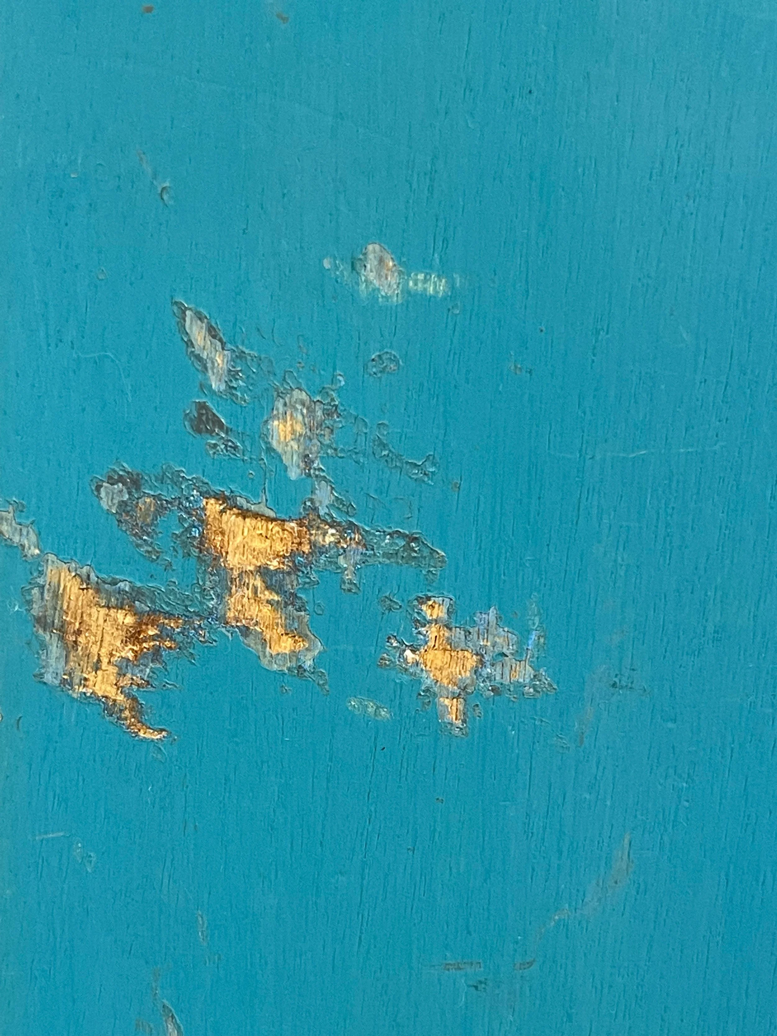 Vintage pair of Twin Rooster wooden water skis in turquoise and yellow with black bindings. Circa 1960s.