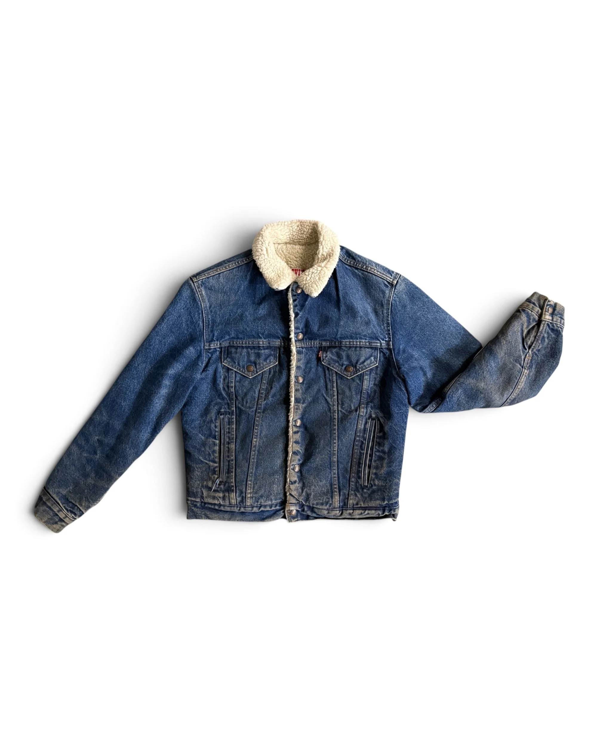 Vintage Levi’s sherpa-lined denim trucker jacket in classic blue wash.