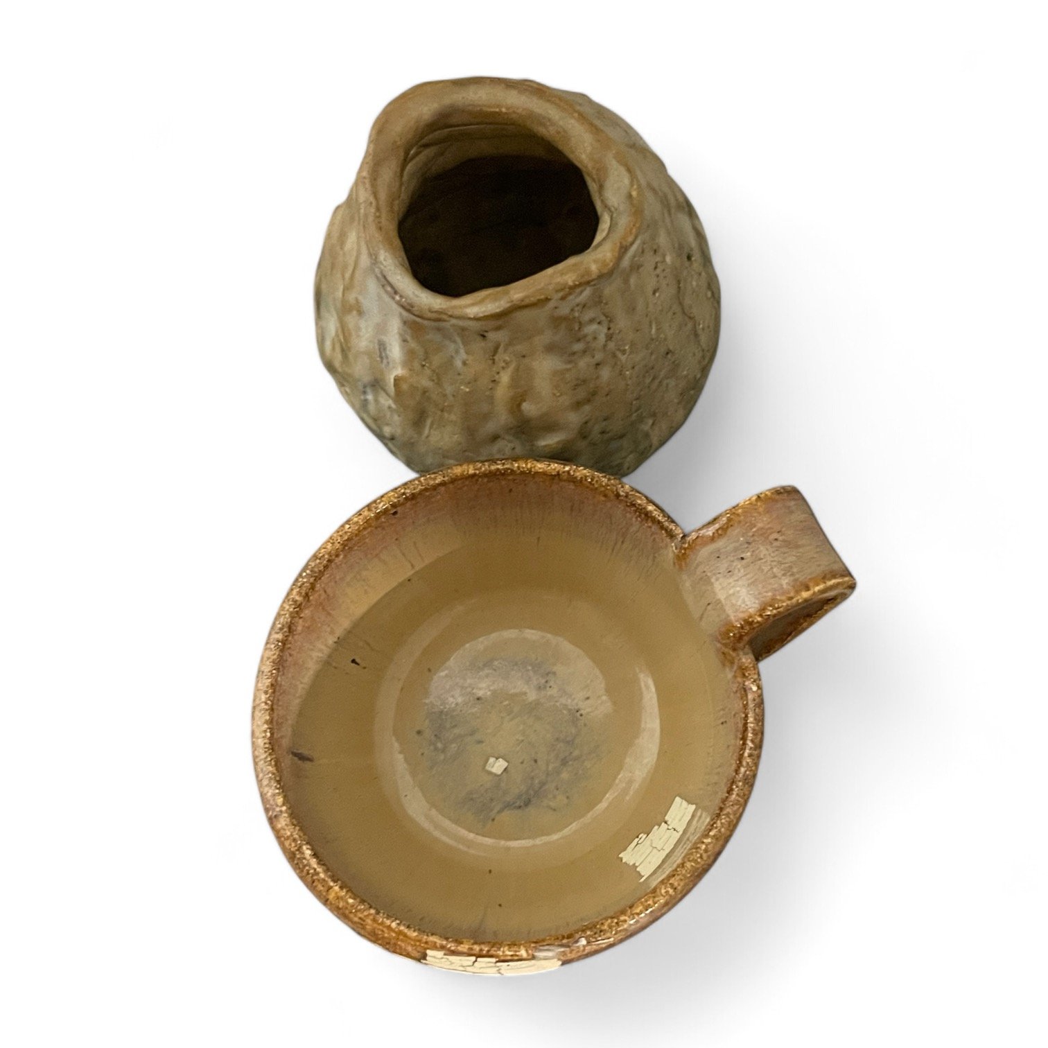 Vintage set of vintage, handmade pottery, featuring drip glaze technique in earth tones. Set includes a vase and cup with handle. Perfect warm, rustic accent for any style decor.