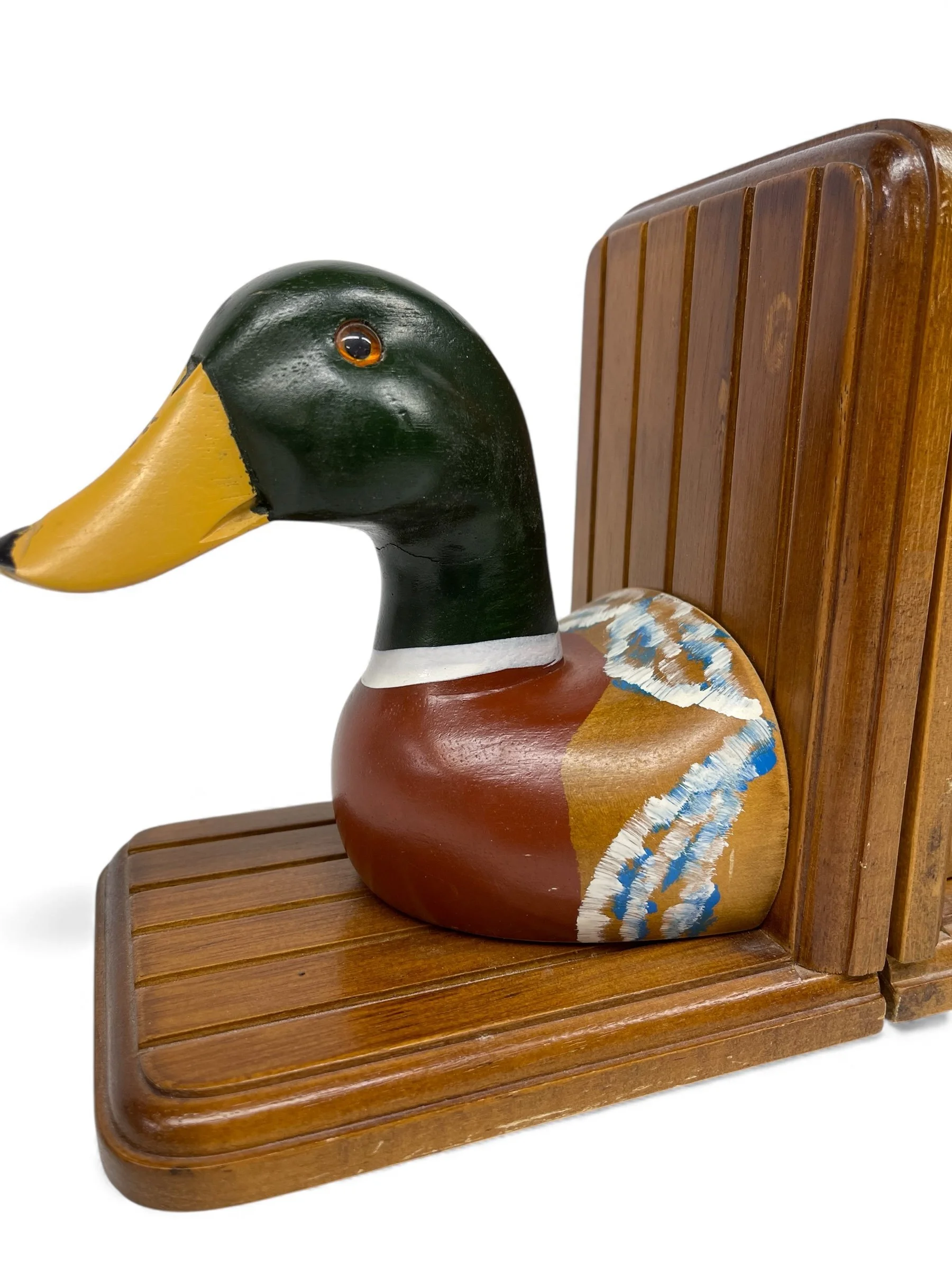 Side view of vintage mallard duck handmade wooden bookend, rustic table or shelf display