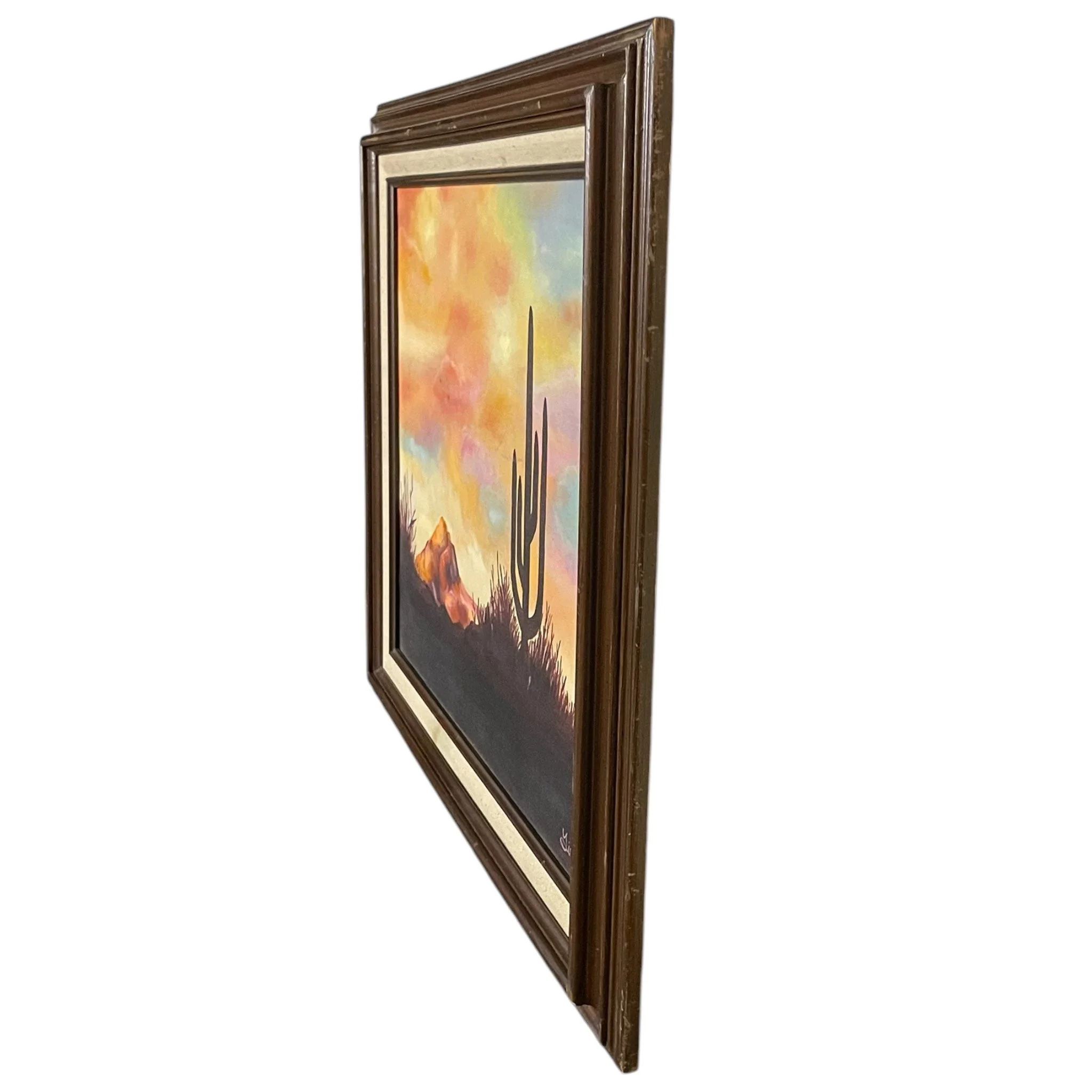 Vintage original oil painting of a desert at sunset featuring cactus, mountain under a colorful sky, framed, signed by artist. Ideal southwestern or boho interior decor.