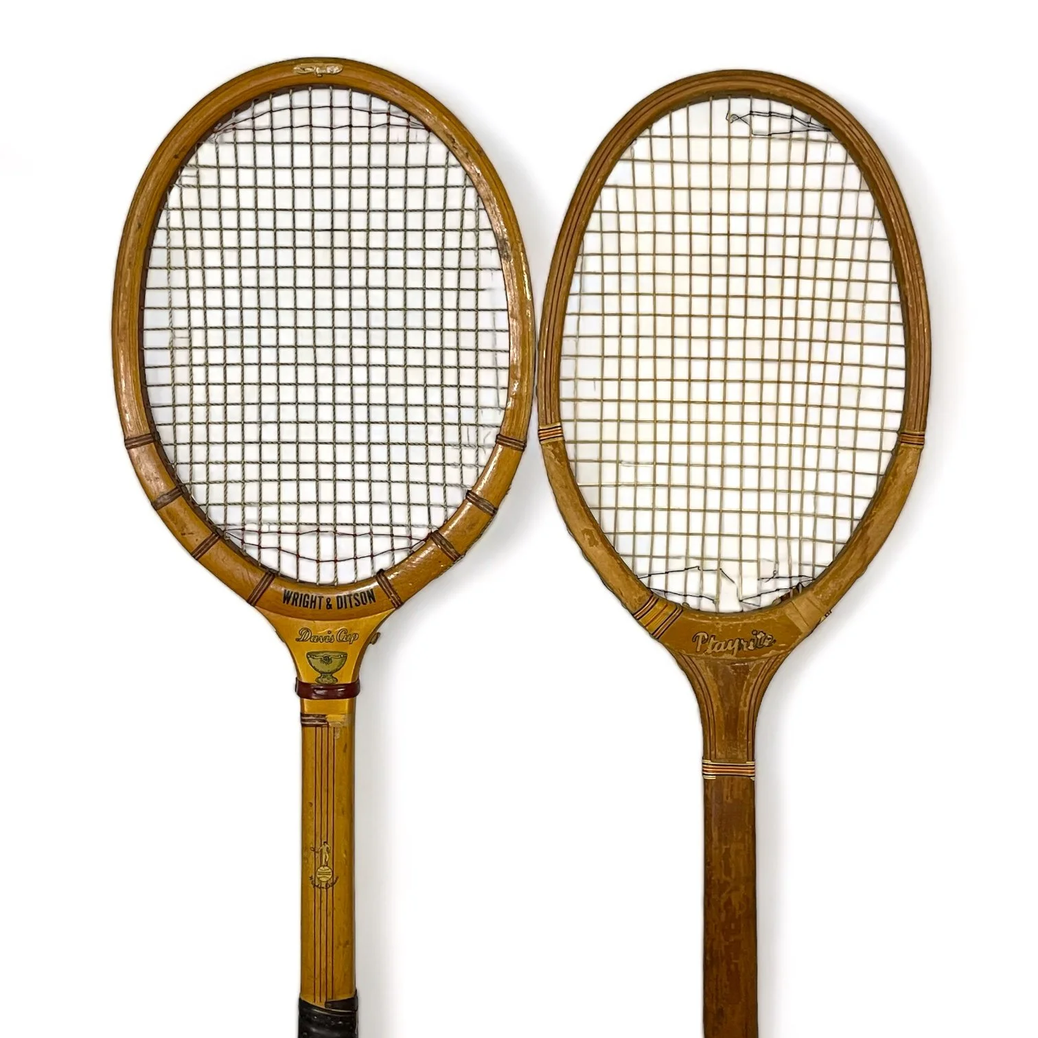 Vintage pair of wooden tennis rackets by Wright & Ditson and Playrite with wood press and canvas covers.