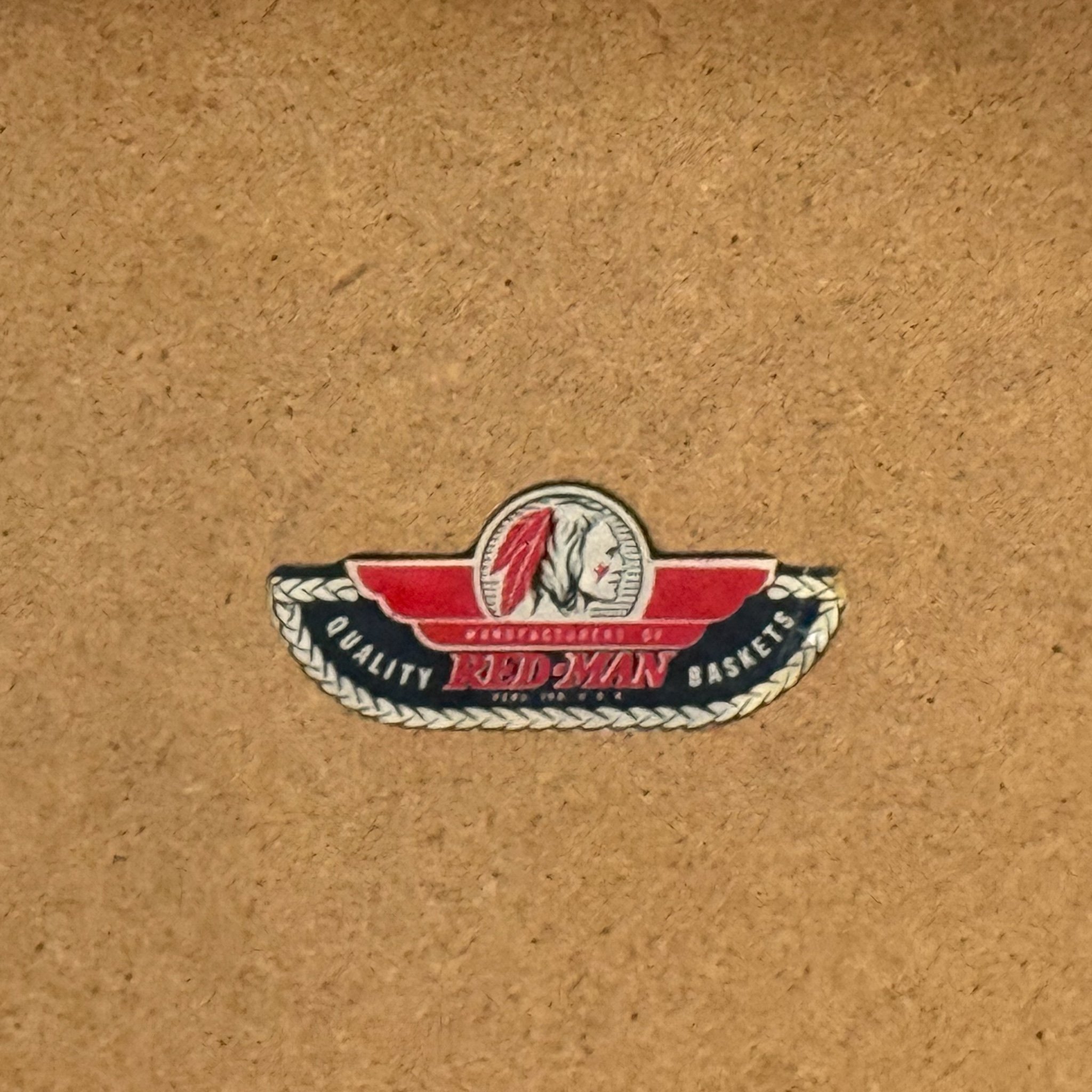 Photo of close up logo on a vintage Red-Man picnic basket.