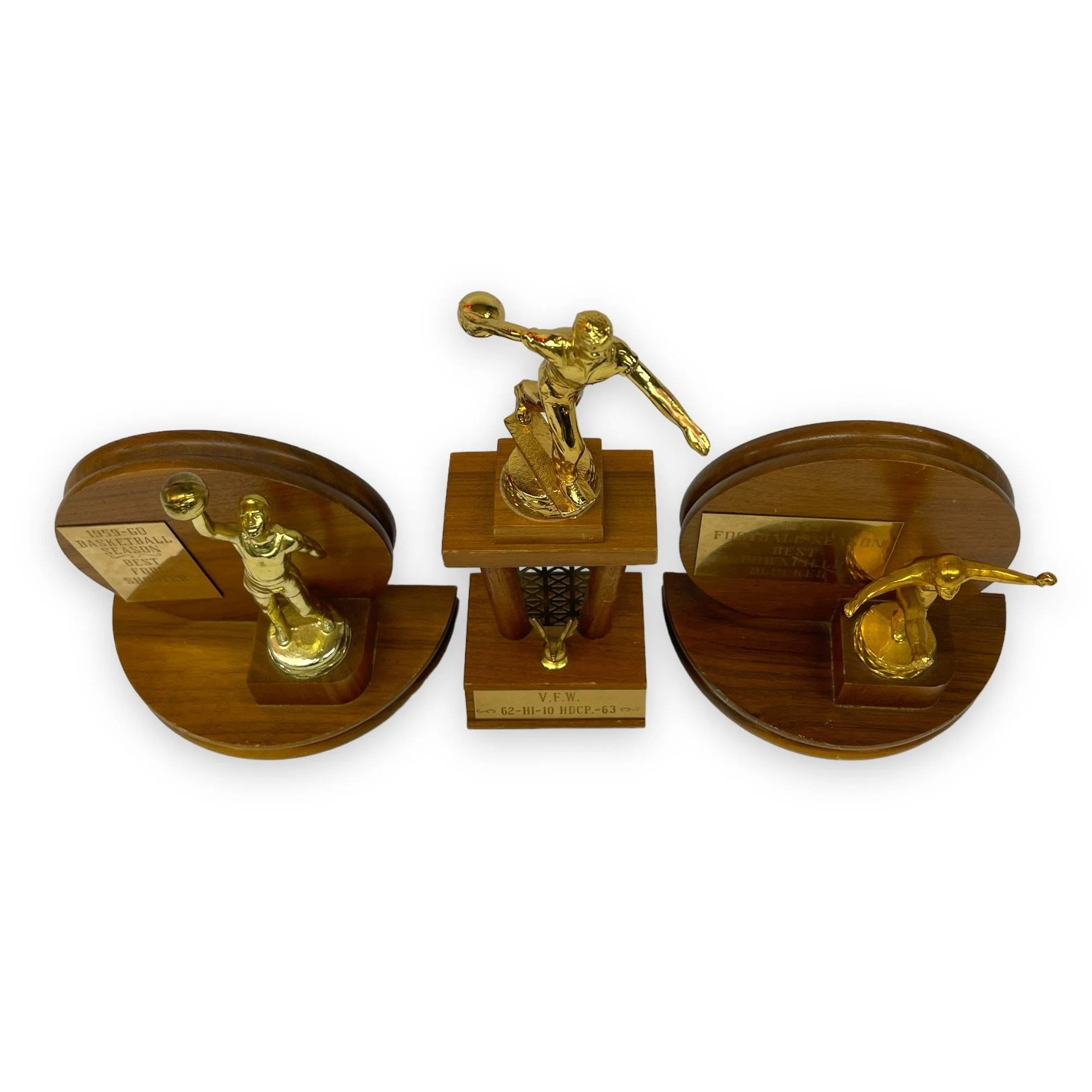 Vintage set of 3 trophies in mid century modern designs. Trophies are from the 50s and 60s and are made of wood with gold metal engraved plates.