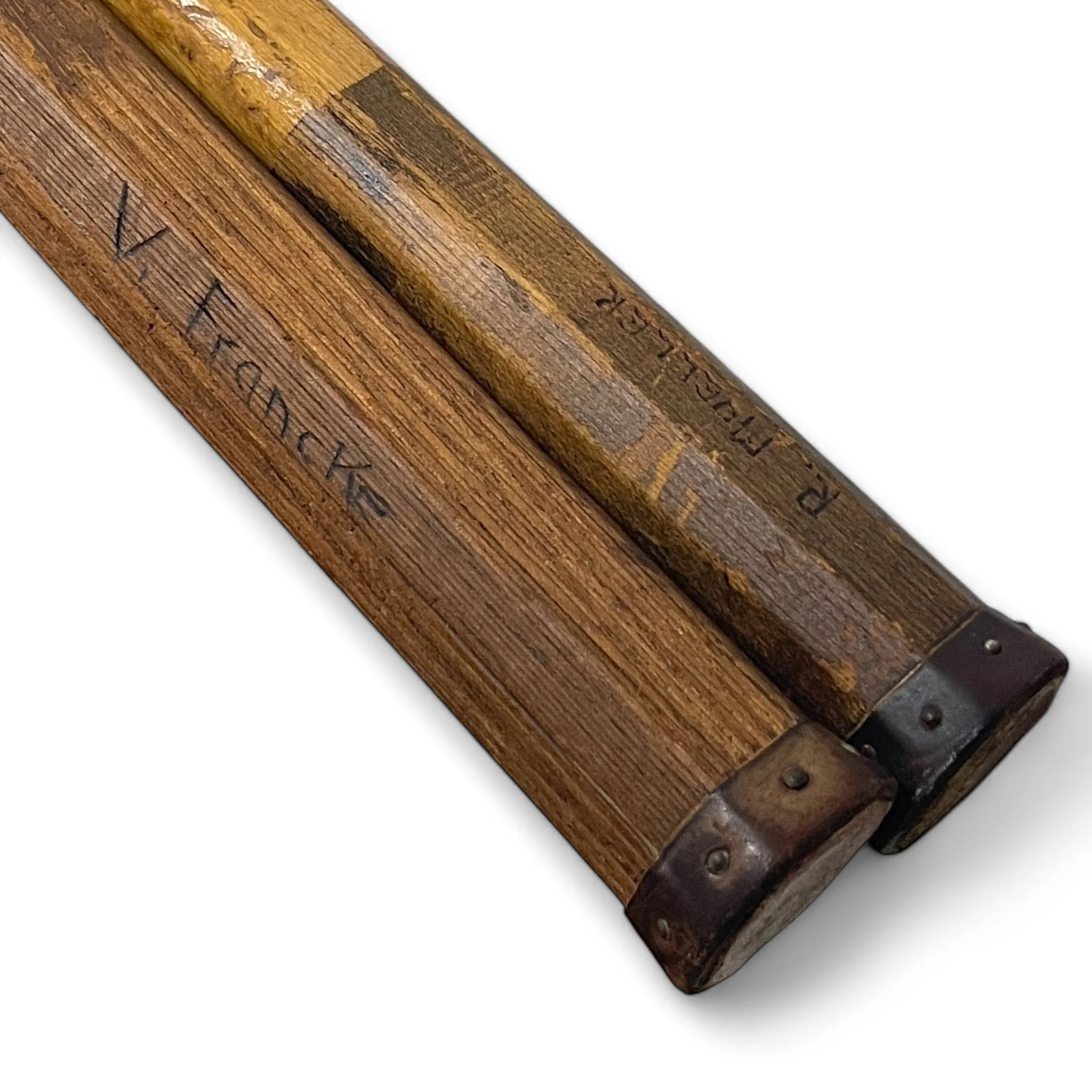 Pair of vintage wooden tennis rackets from the 1920s-30s, perfect for antique sports decor and collectibles.