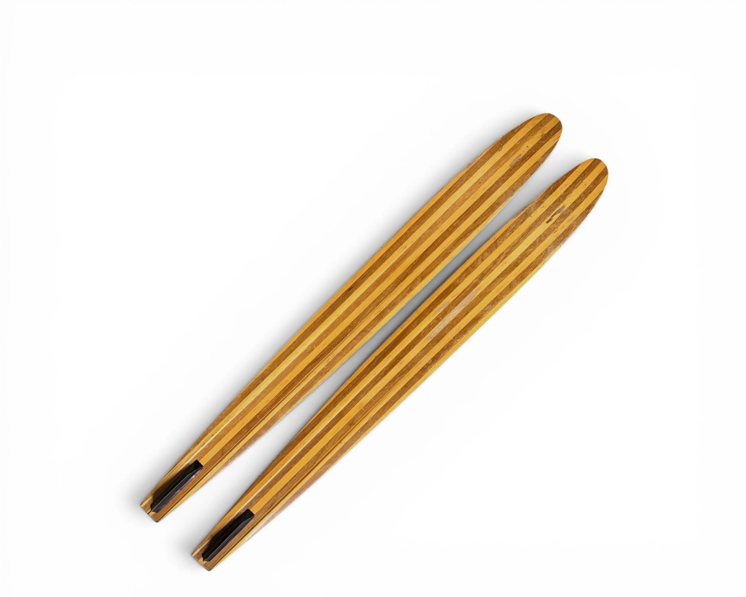 back view of vintage wooden water skis showcasing wood grain