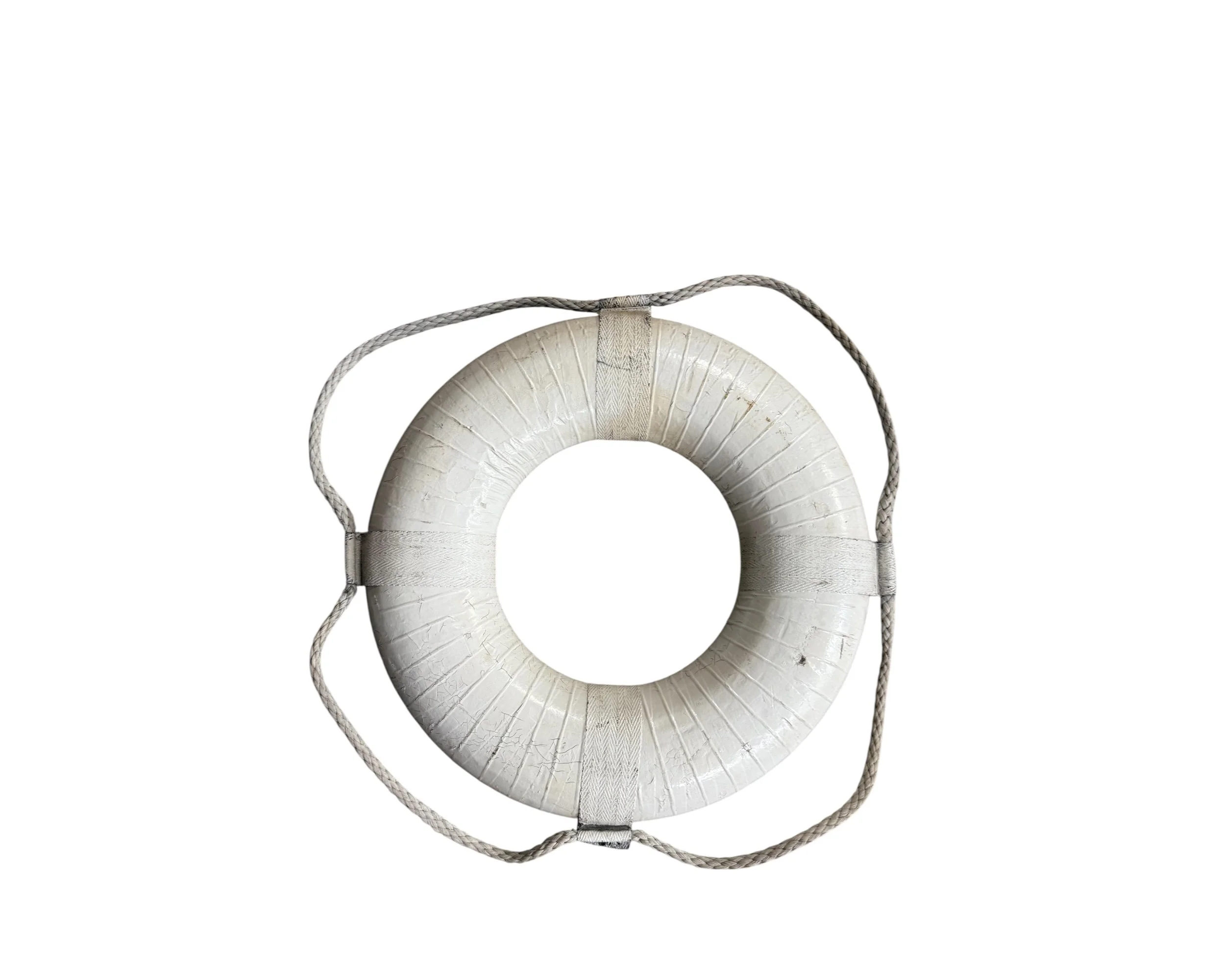 back view of antique white life preserver ring with nautical rope detailing for authentic beach house wall art