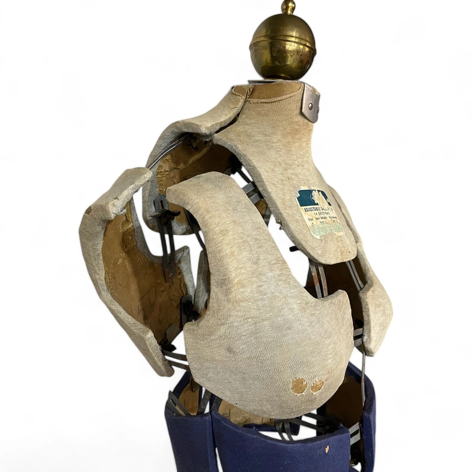 Side view of a vintage Hearthside adjustable female dress form with stand.