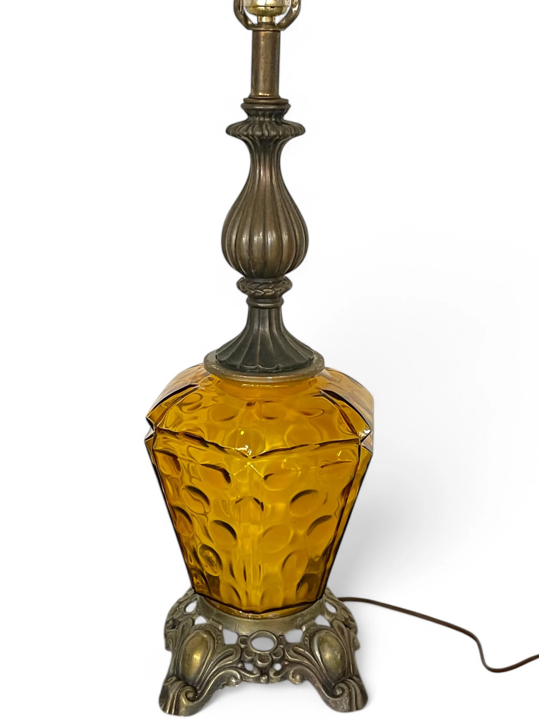 Vintage amber glass and ornate metal table lamp, no shade. Featuring double light option. Perfect for Hollywood Regency, Spanish Revival, or mid century modern interiors.