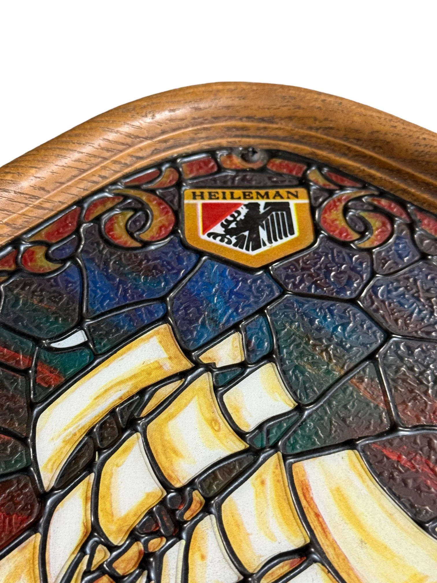 Close-up of stained glass sailboat design and logo on Heileman’s beer light.