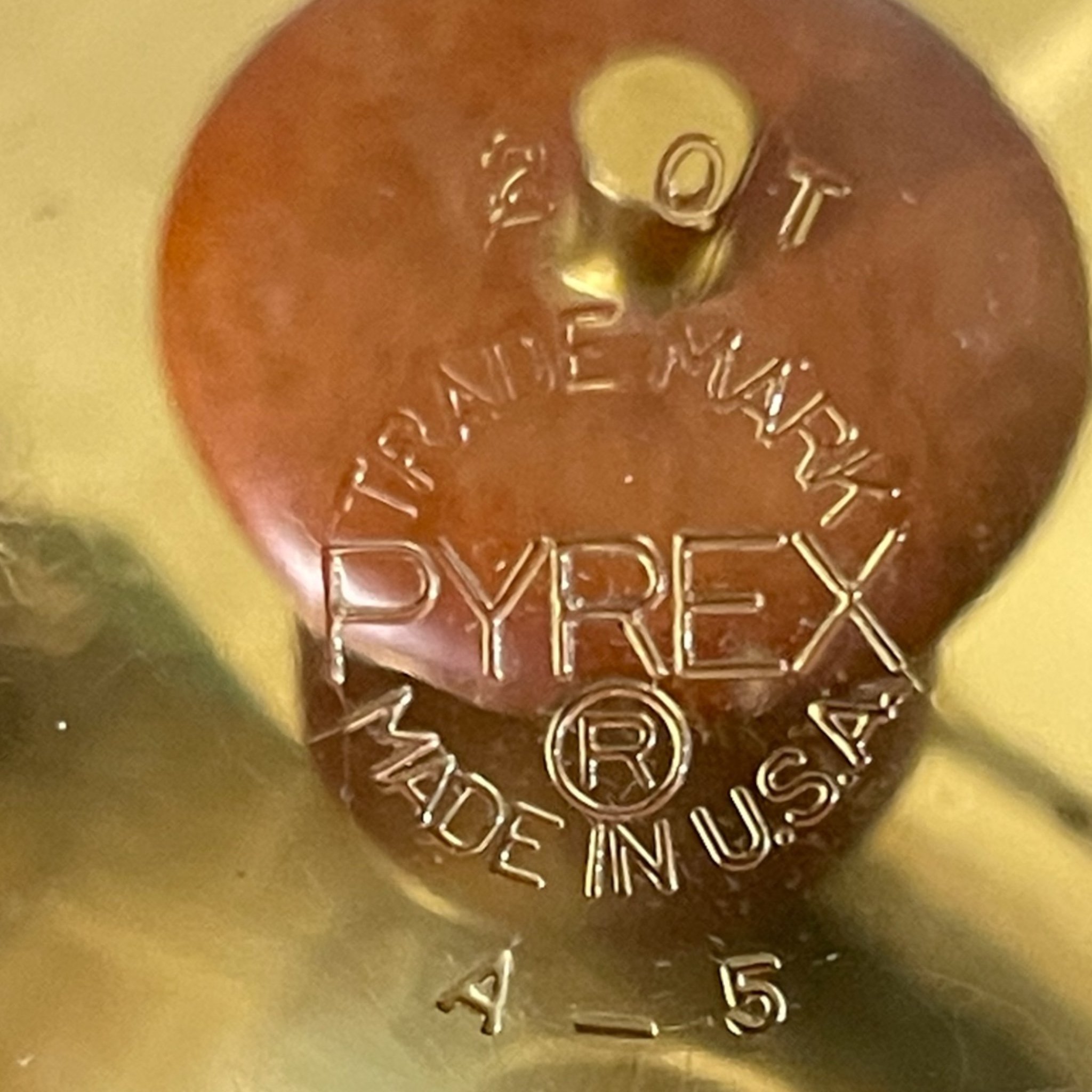 Vintage set of two Pyrex glass serving dishes with gold lids and teak wood accents on the handles. Mid Century Modern kitchen buffet dishes for entertaining or display.