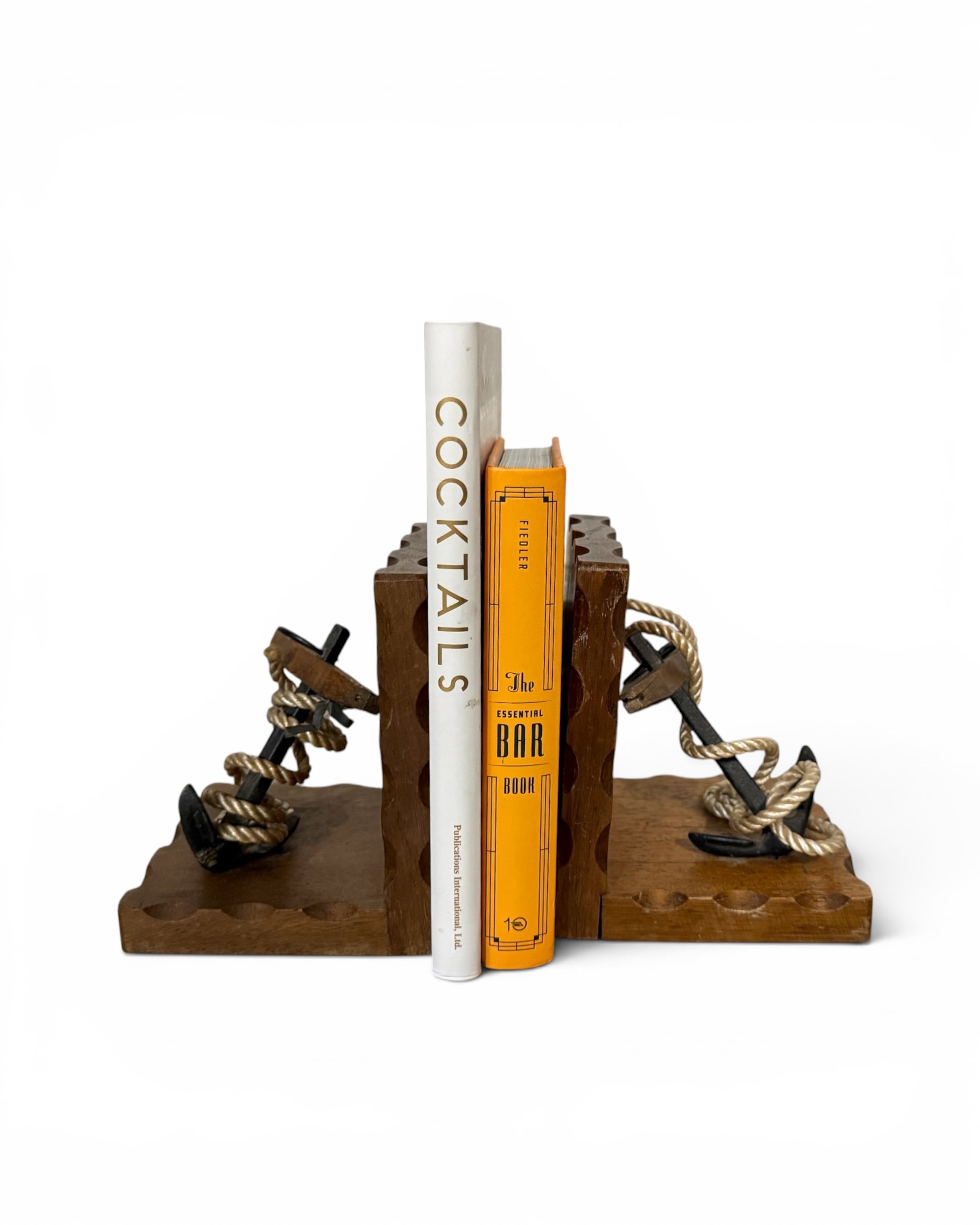 Vintage wooden anchor bookends with rope accents displayed together with books.
