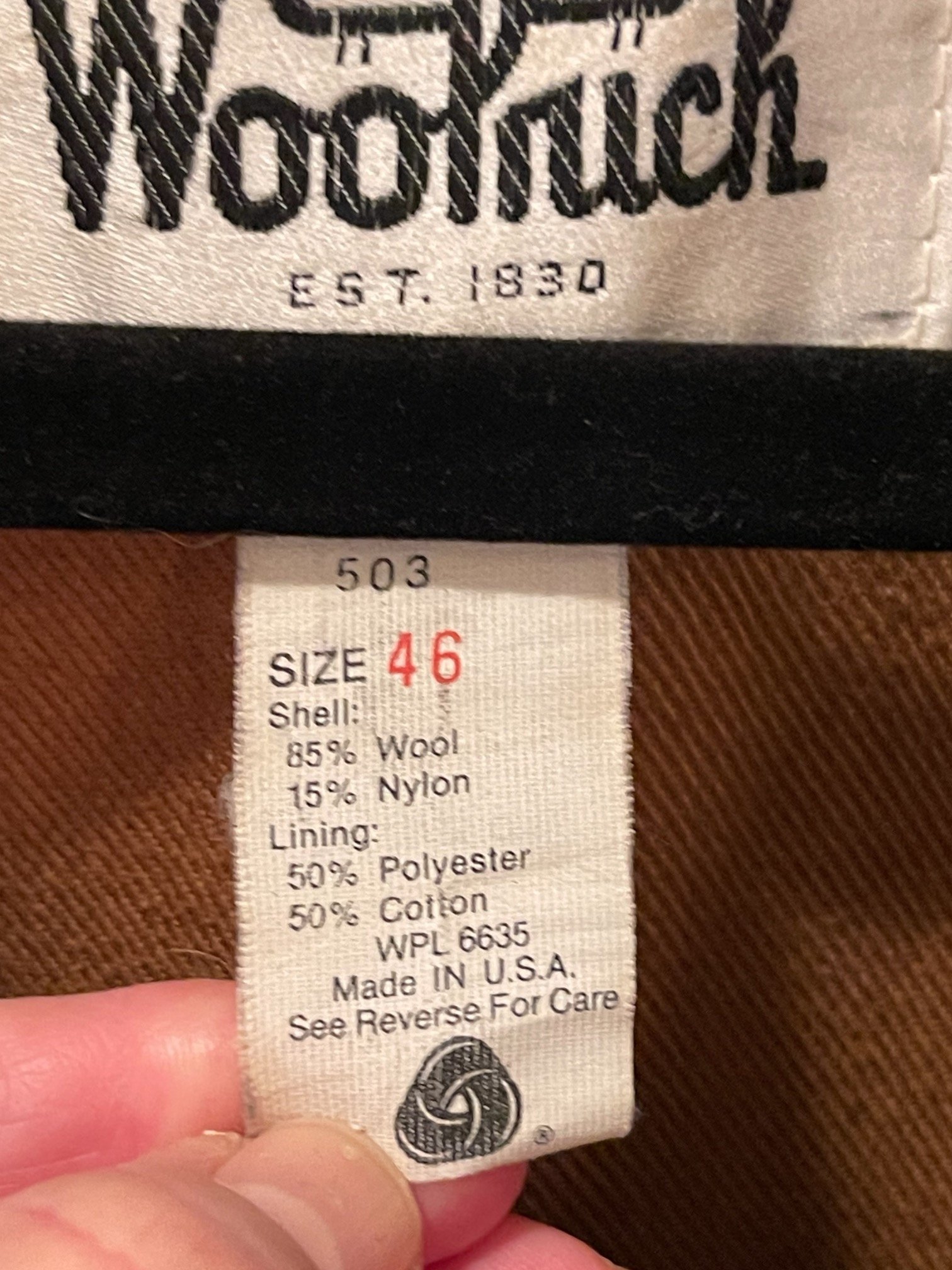 Vintage 70s Woolrich black red plaid jacket. Size 46, fully lined, hidden button front closure with 6 front pockets with snap closure,  full game pocket. This Mackinaw style coat Made in USA.