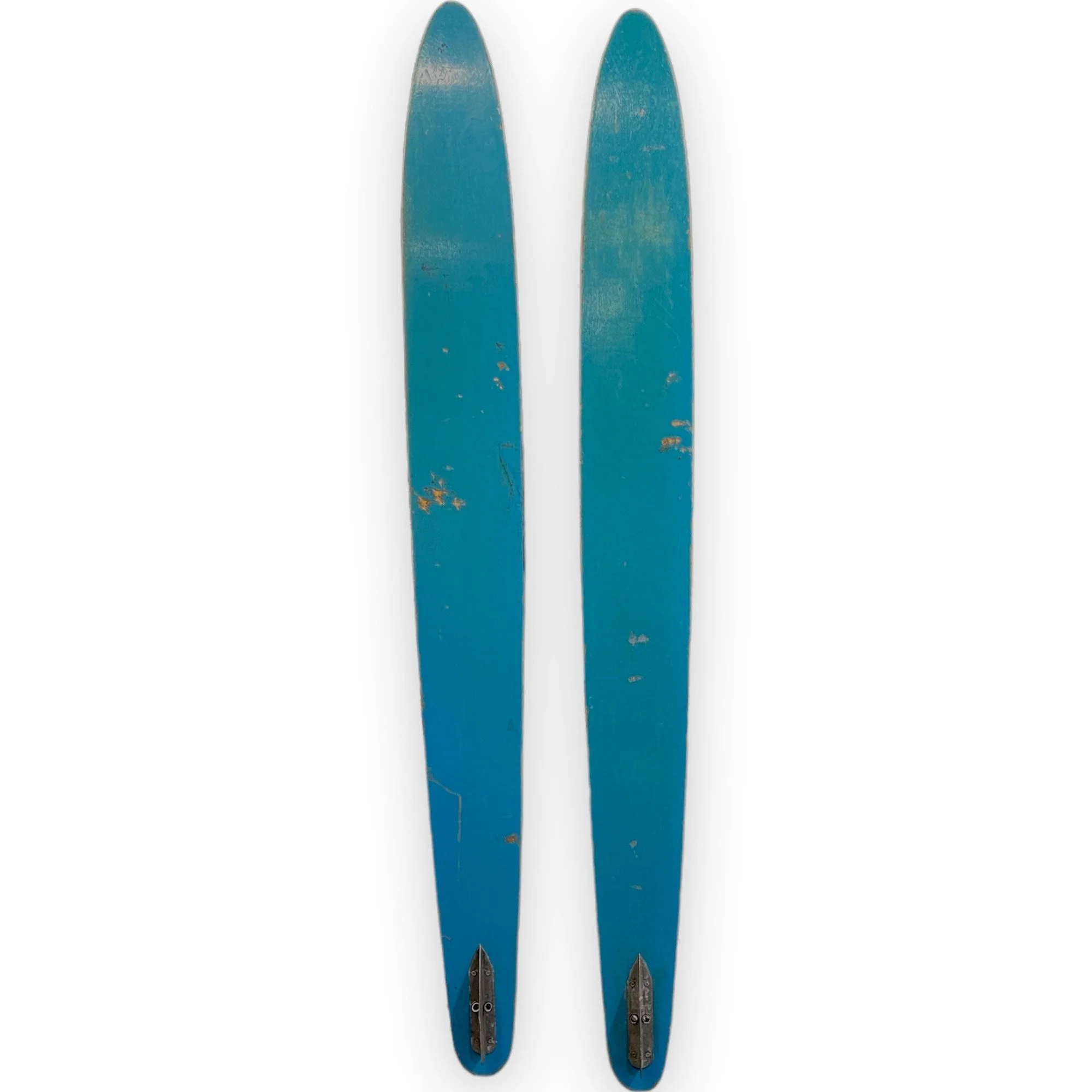 Vintage pair of Twin Rooster wooden water skis in turquoise and yellow with black bindings. Circa 1960s.
