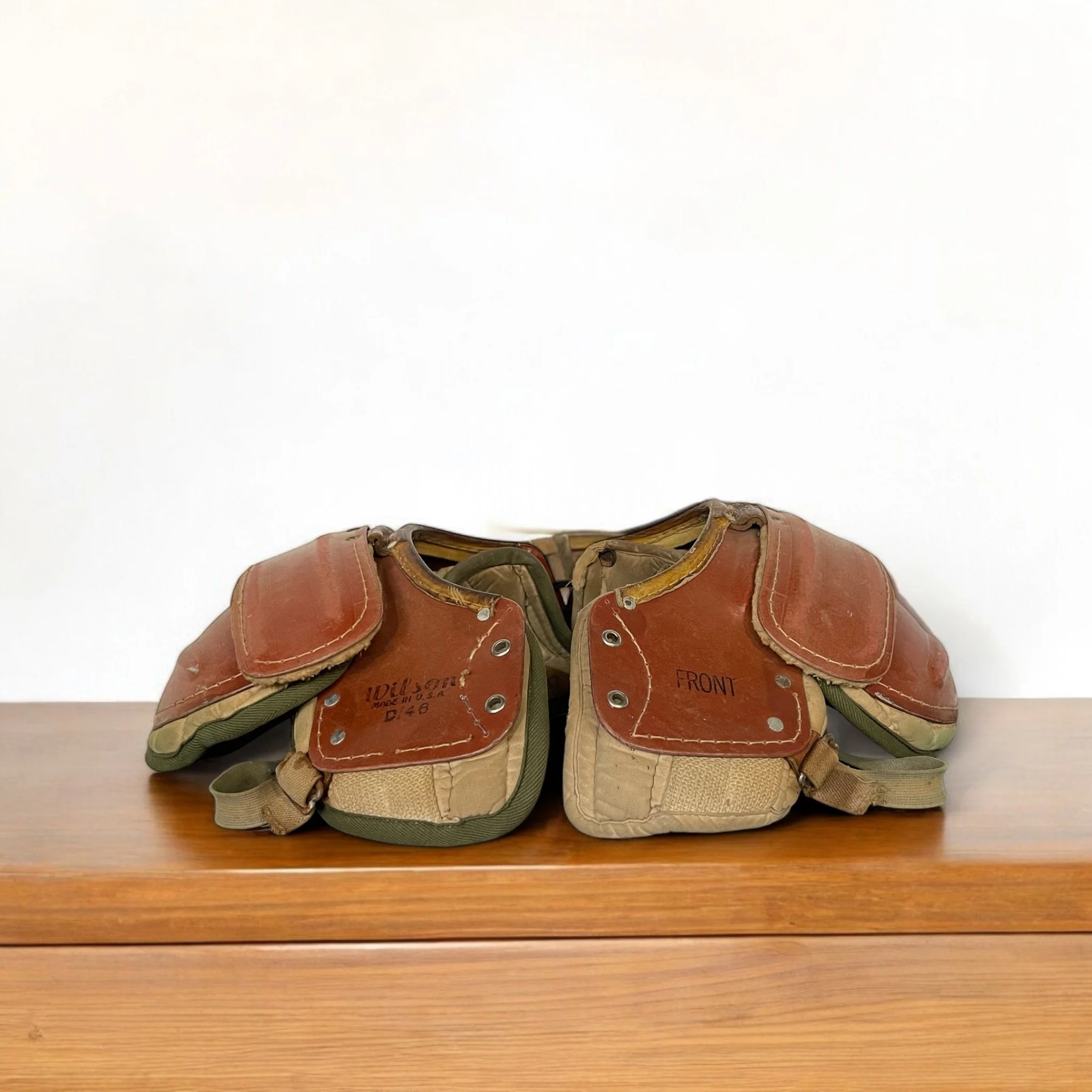 Vintage 1950s Wilson D146 football shoulder pads, made in USA, unique sports collectible or game room decor.