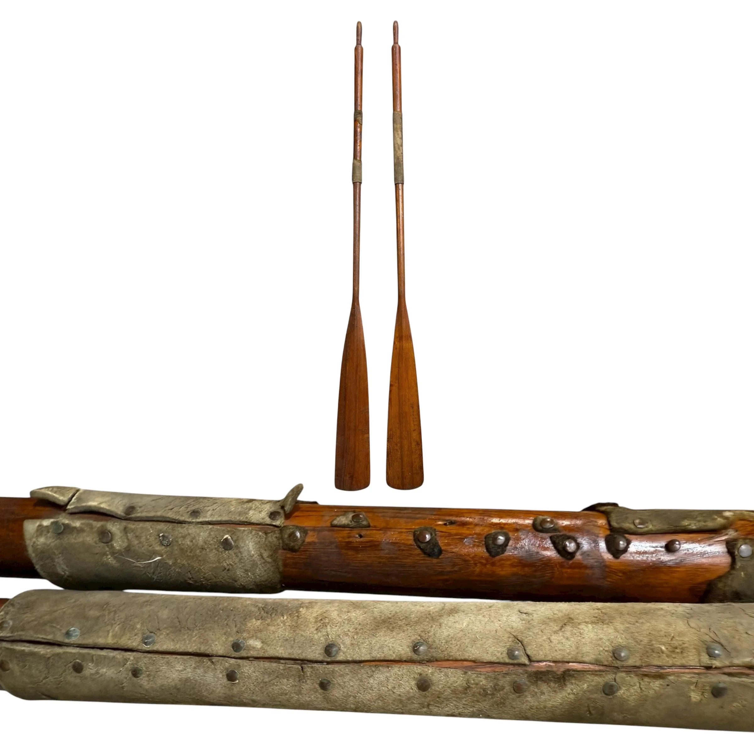 Pair of vintage wooden boat oars with leather handle grips, rustic wall decor.