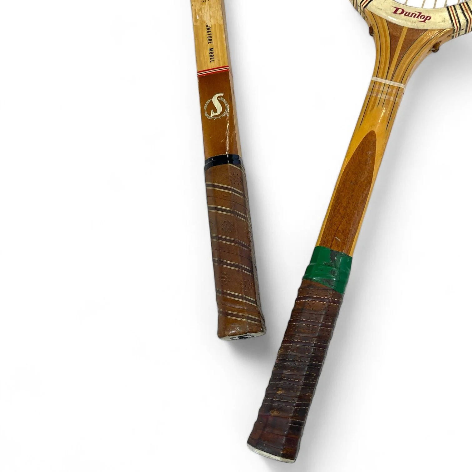 Vintage pair of wooden tennis rackets, Dunlop Maxply, Spalding Gonzales signature model.